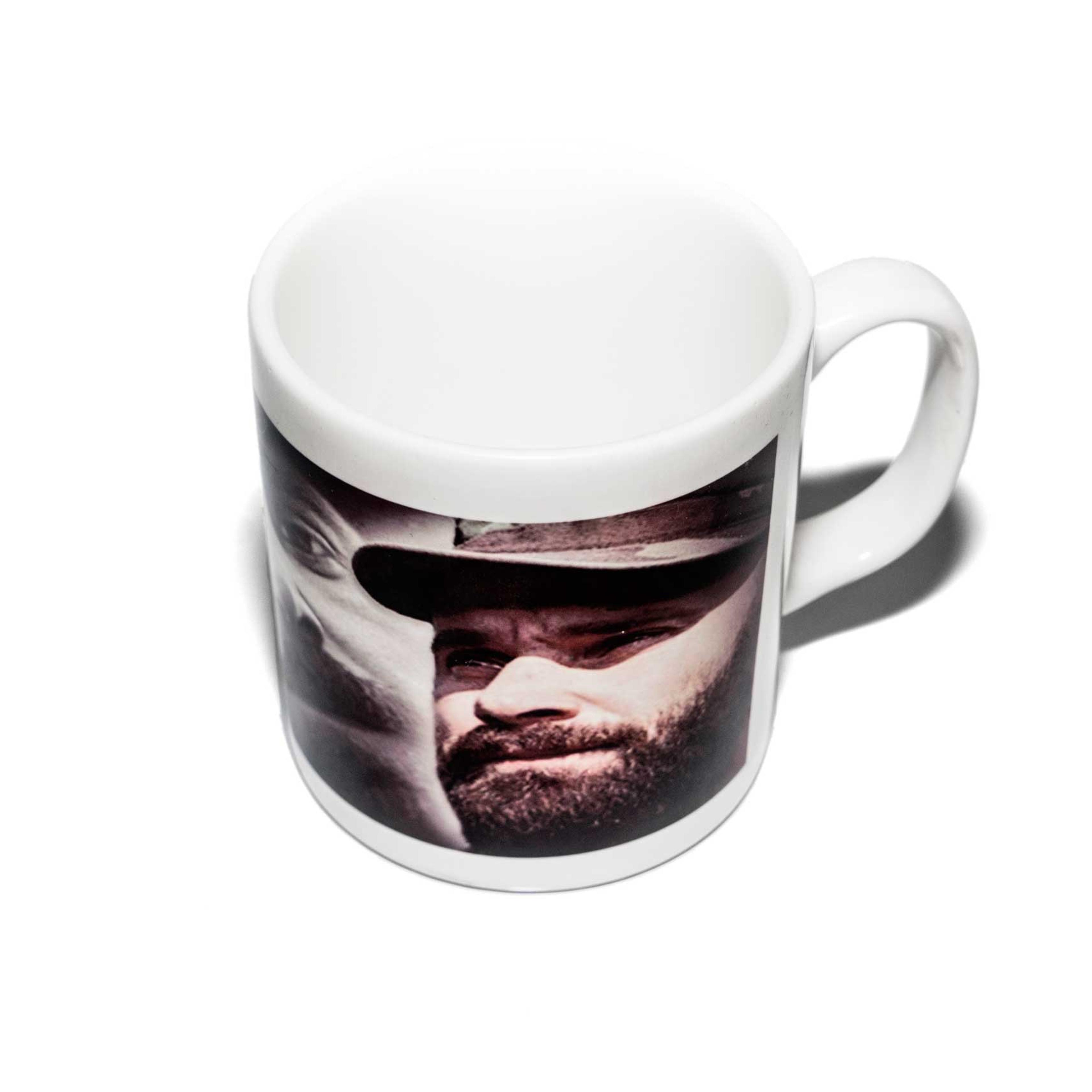 Items of clothing and objects found in a Islamic clothing and accessory shop in the Bagicilar district of Istanbul. A western style tea mug with a millitant commaners portrait on the side.