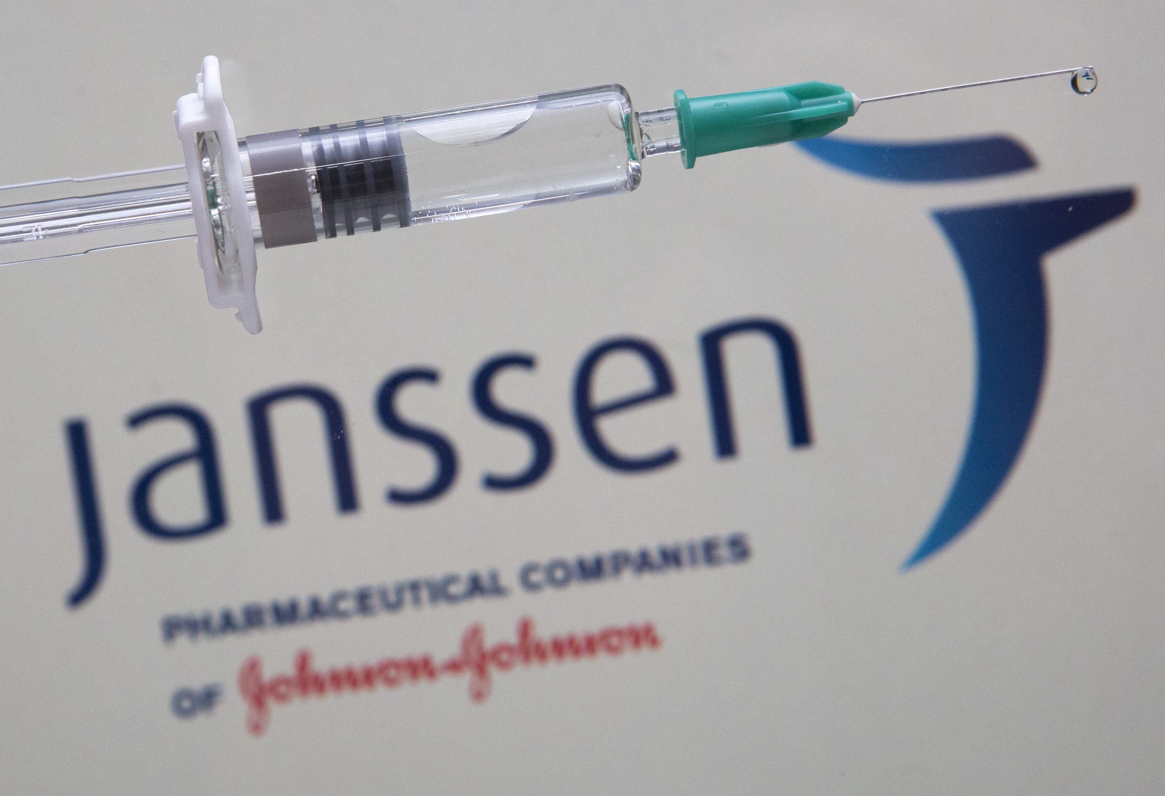 Syringe with the logo of the pharmaceutical company Janssen (Johnson &amp; Johnson).
