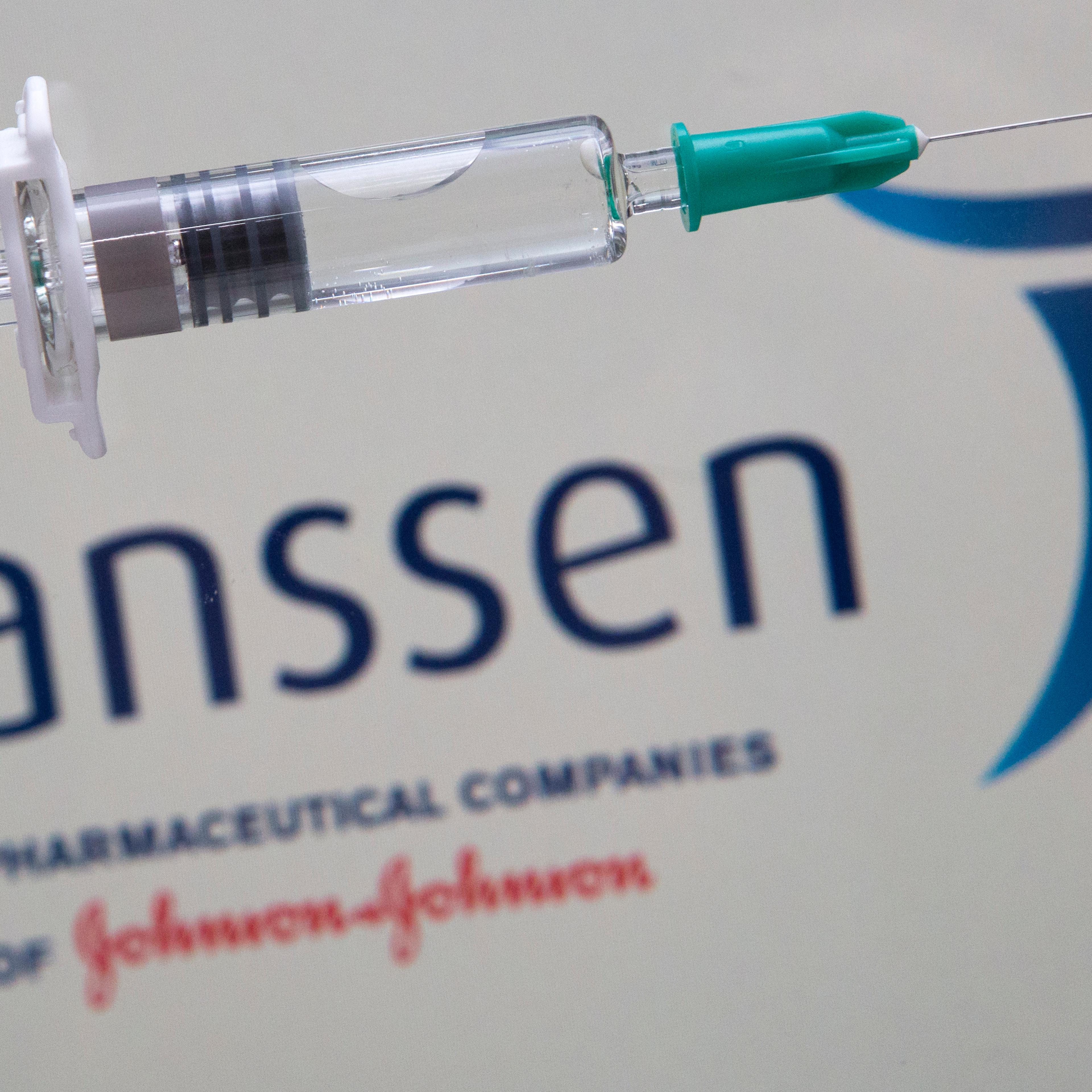 Syringe with the logo of the pharmaceutical company Janssen (Johnson & Johnson).