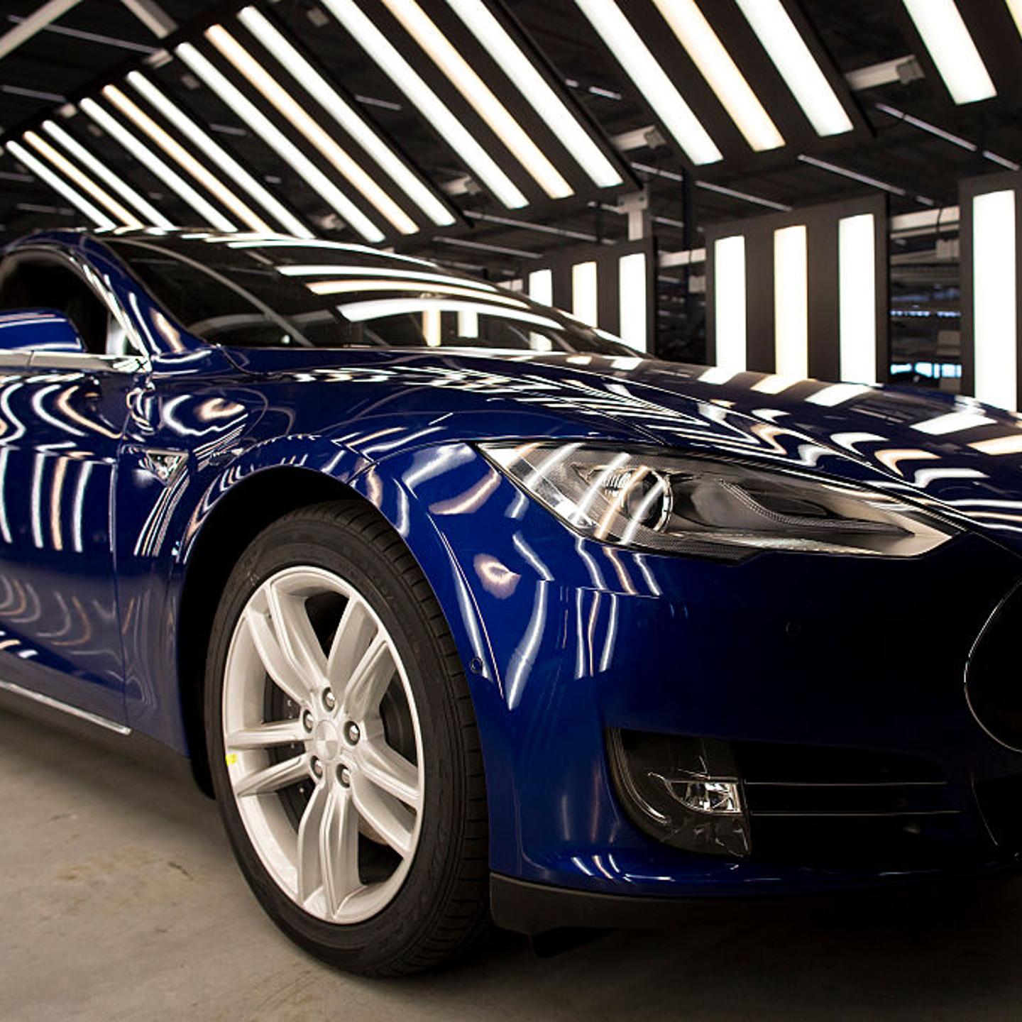 A Tesla Model S automobile stands in a light tunnel during quality control checks ahead of European shipping from the Tesla Motors Inc. factory in Tilburg, Netherlands, on Oct. 8, 2015.