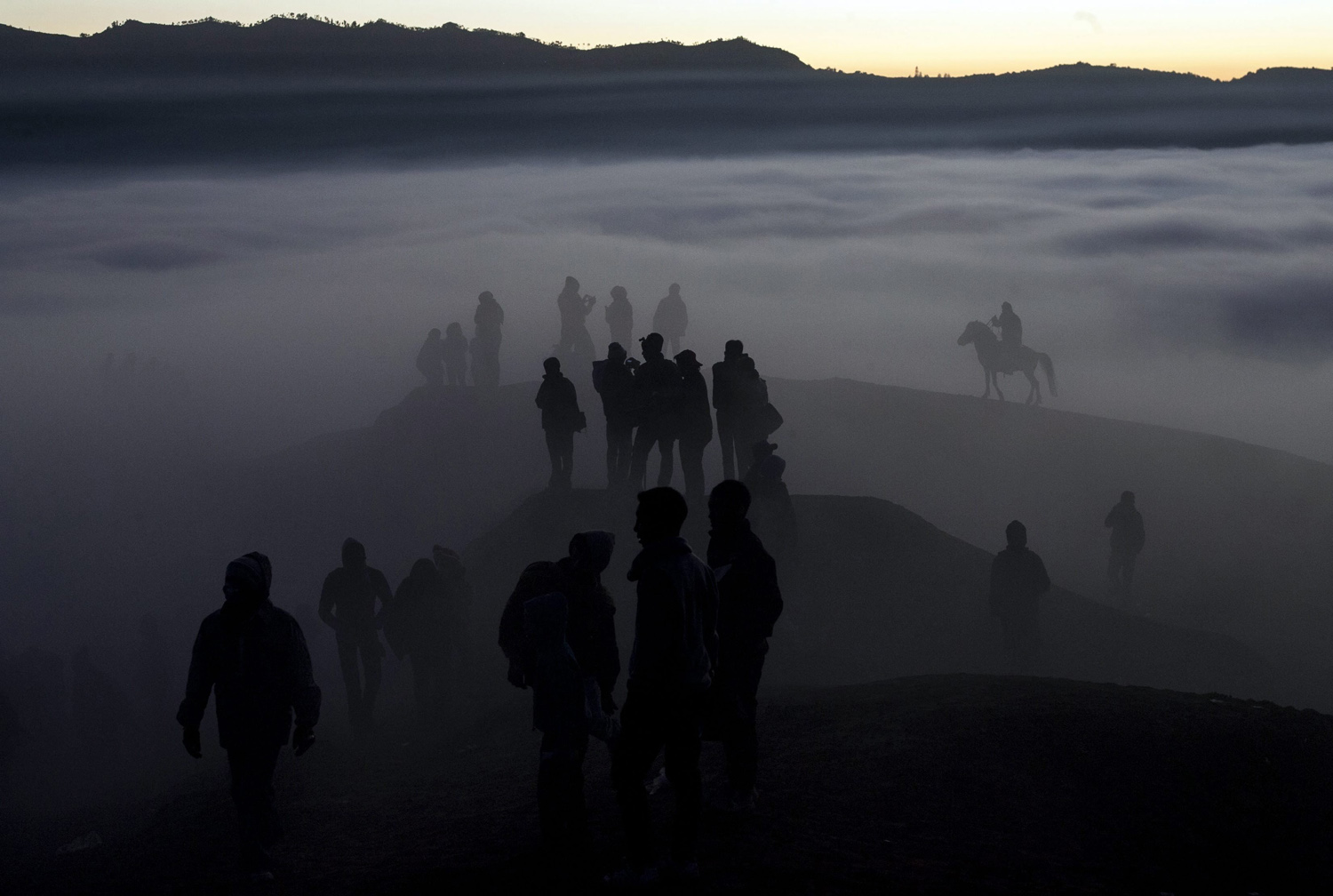 Aug. 12, 2014. Indonesian villagers walk to the crater during the Kasodo ceremony at Mount Bromo, Probolinggo, Indonesia.