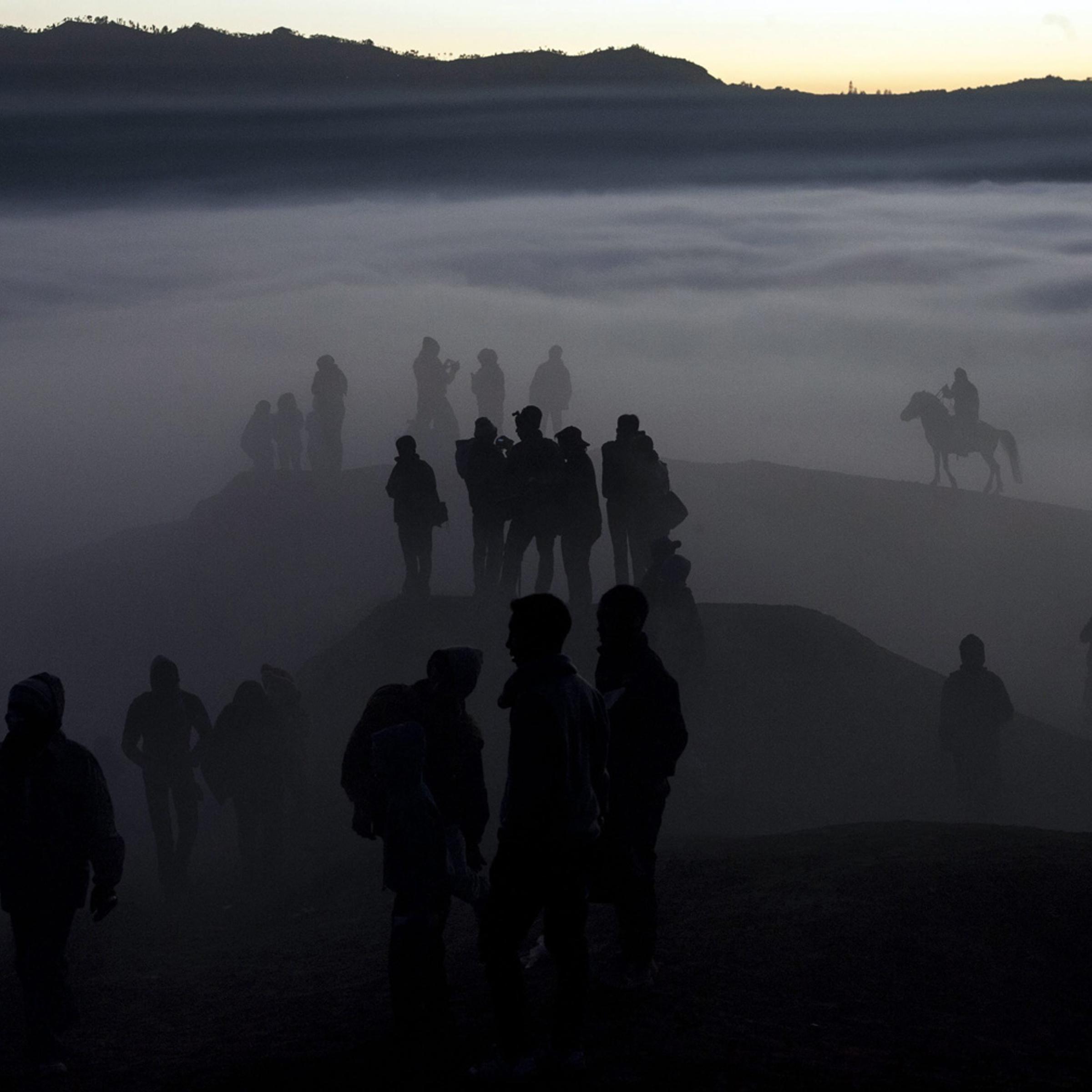 Aug. 12, 2014. Indonesian villagers walk to the crater during the Kasodo ceremony at Mount Bromo, Probolinggo, Indonesia.