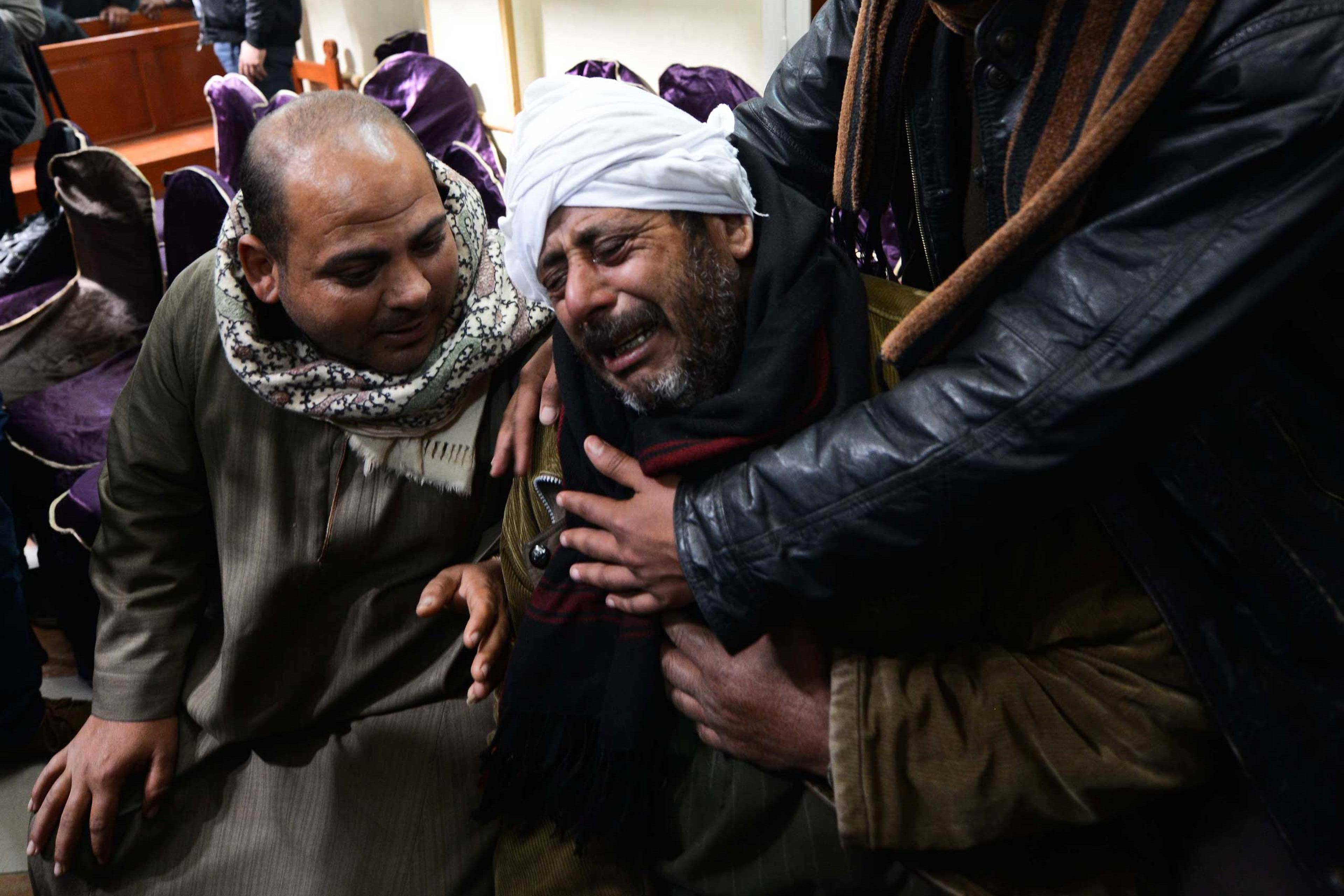 Relatives of Egyptian Coptic Christians purportedly killed by ISIS militants in Libya react after hearing the news on Feb. 16, 2015 in the village of Al-Awar in Egypt's southern province of Minya.