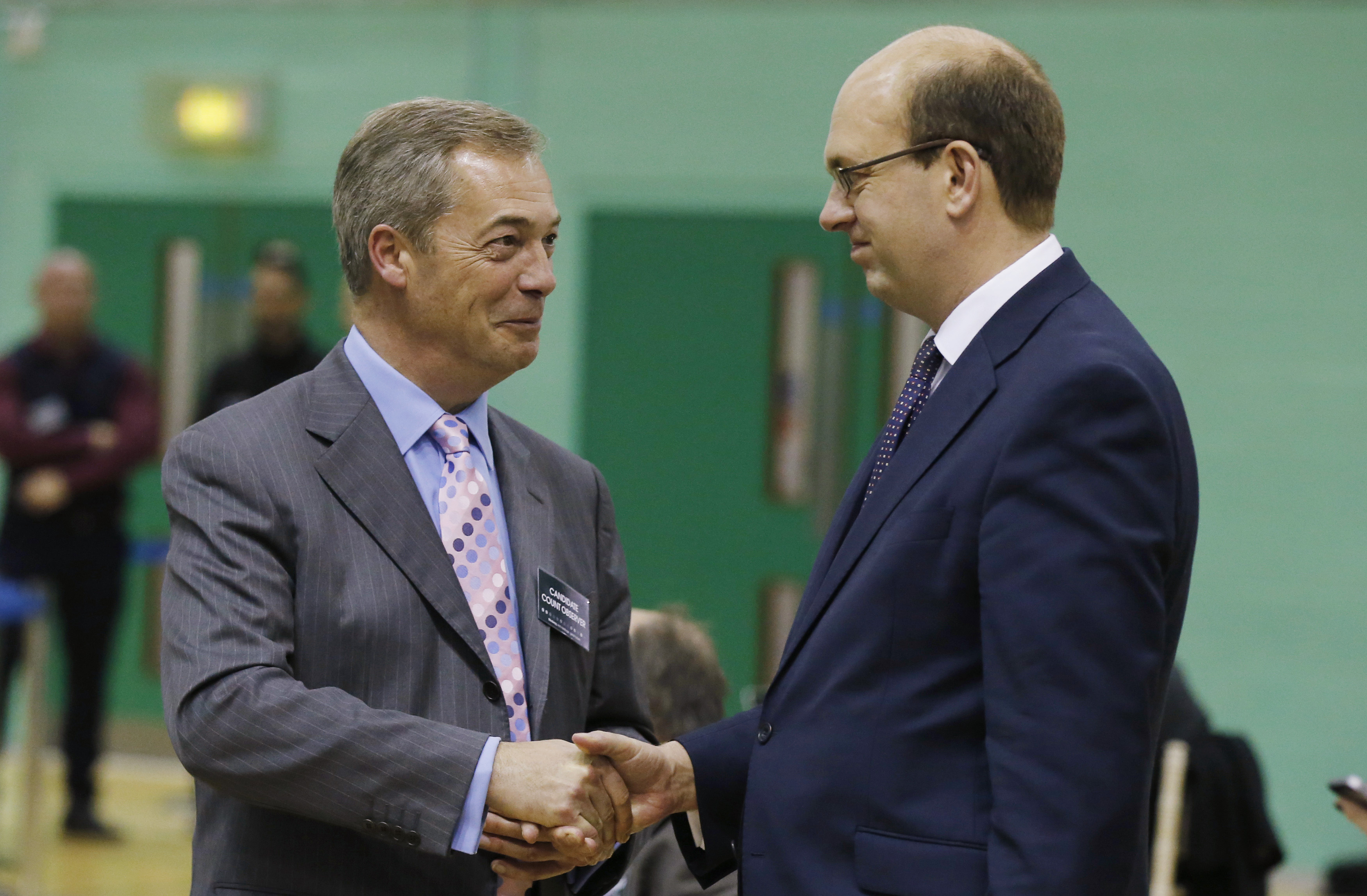 Nigel Farage, leader of UKIP, shakes hands with Mark Reckless in Gillingham