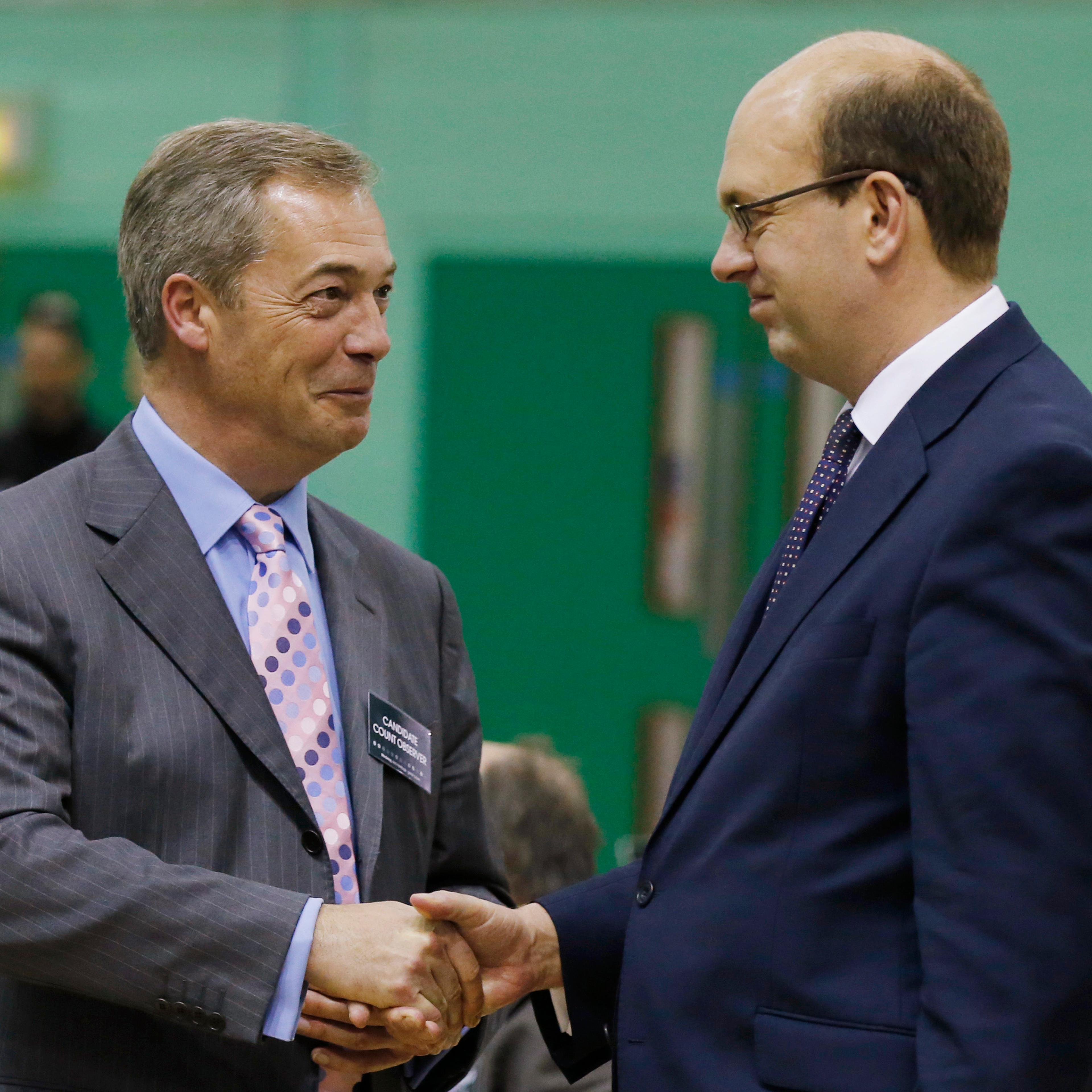 Nigel Farage, leader of UKIP, shakes hands with Mark Reckless in Gillingham