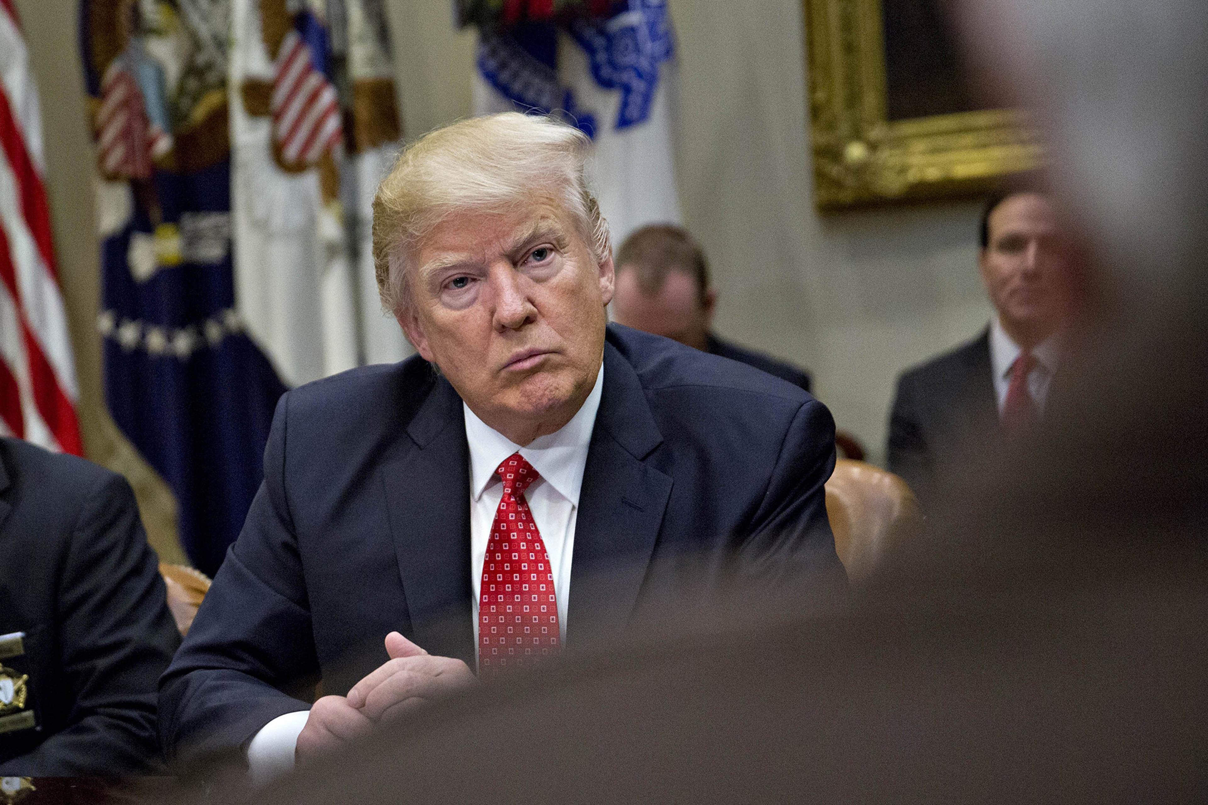 President Donald Trump listens during a listening session in the Roosevelt Room of the White House in Washington, on Feb. 7, 2017.