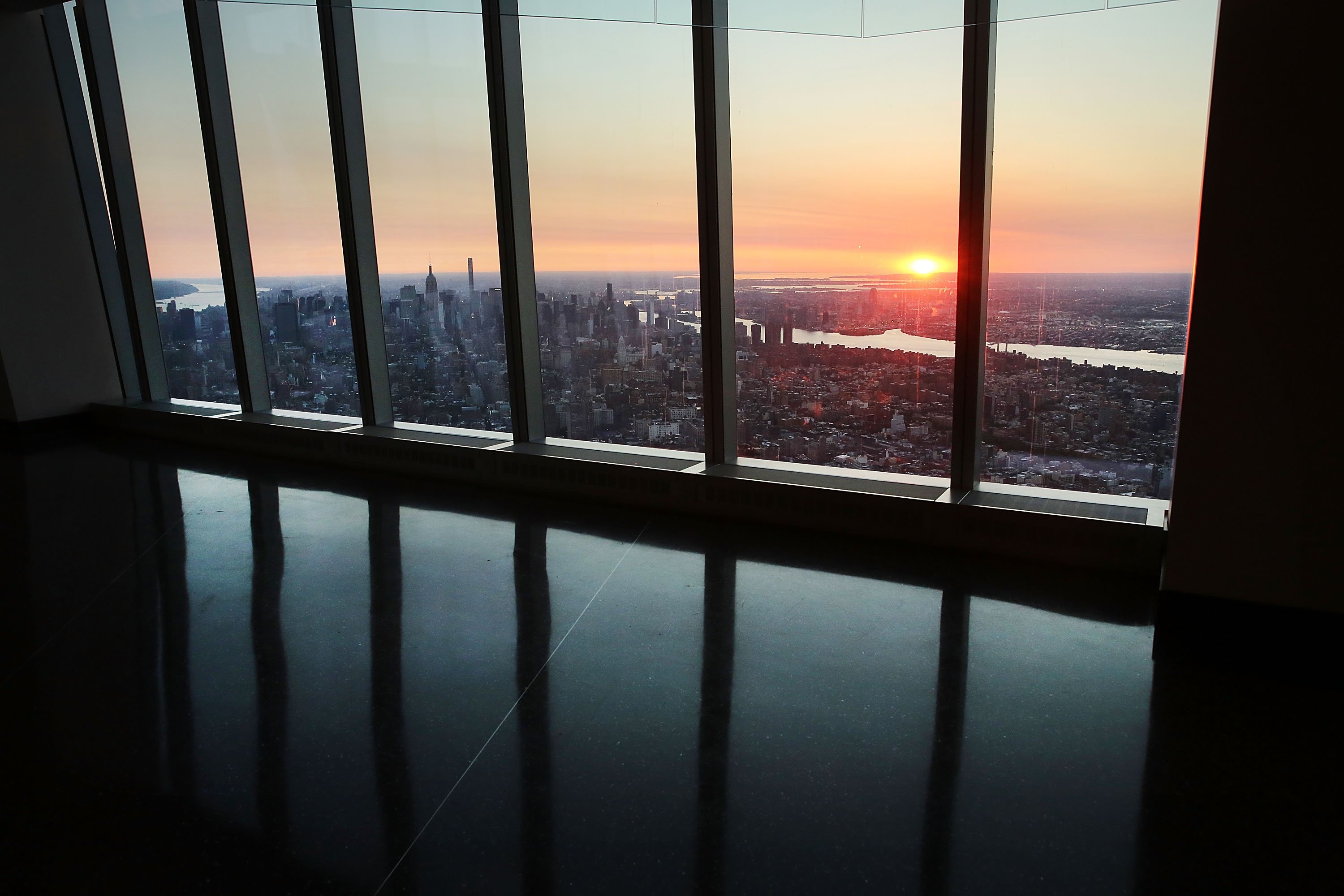 Manhattan is viewed at dawn from the newly built One World Observatory at One World Trade Center on the day it opens to the public on May 29, 2015 in New York City.