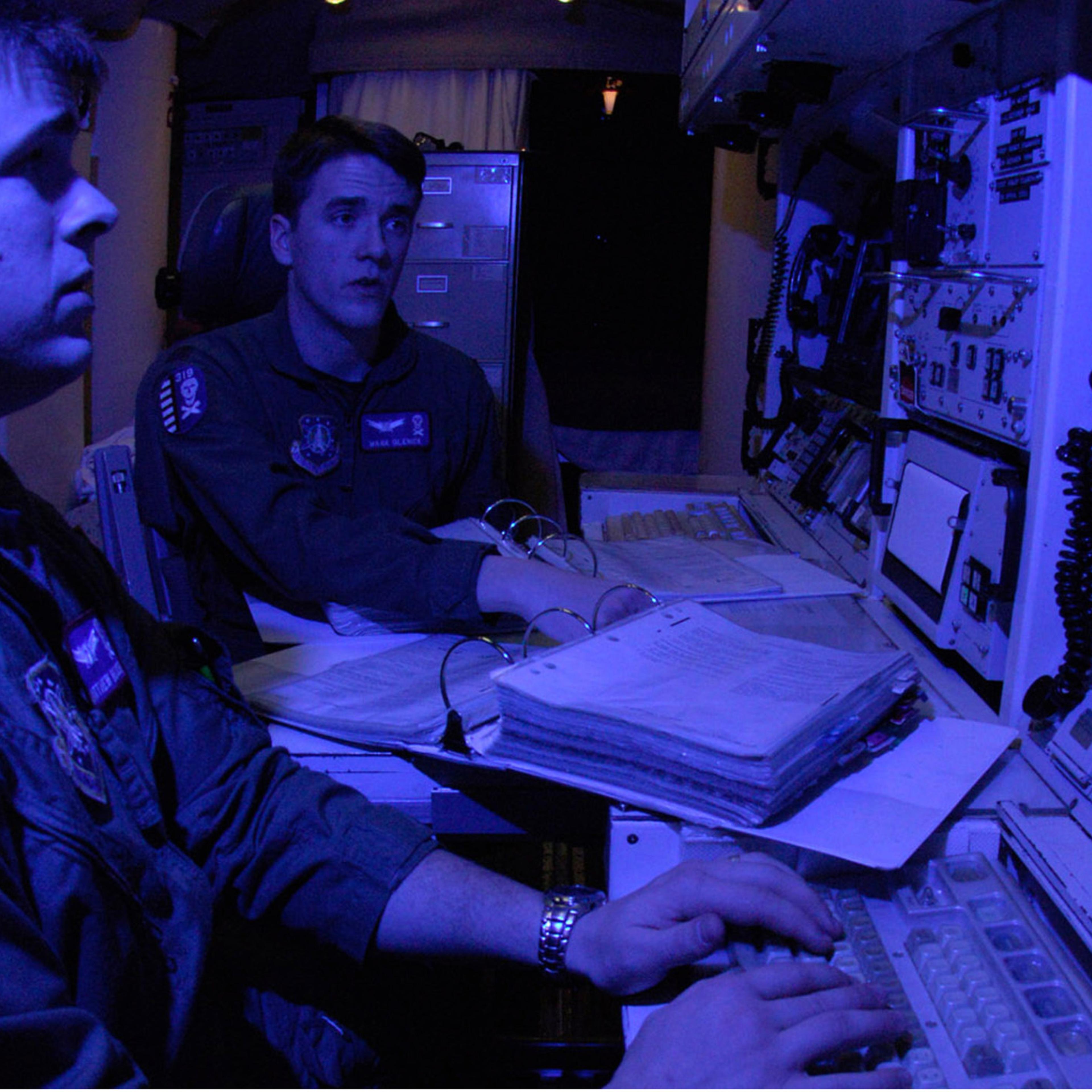 A pair of Air Force missile launch control officers, having passed their monthly proficiency tests, pull alert at a Minuteman III missile site.