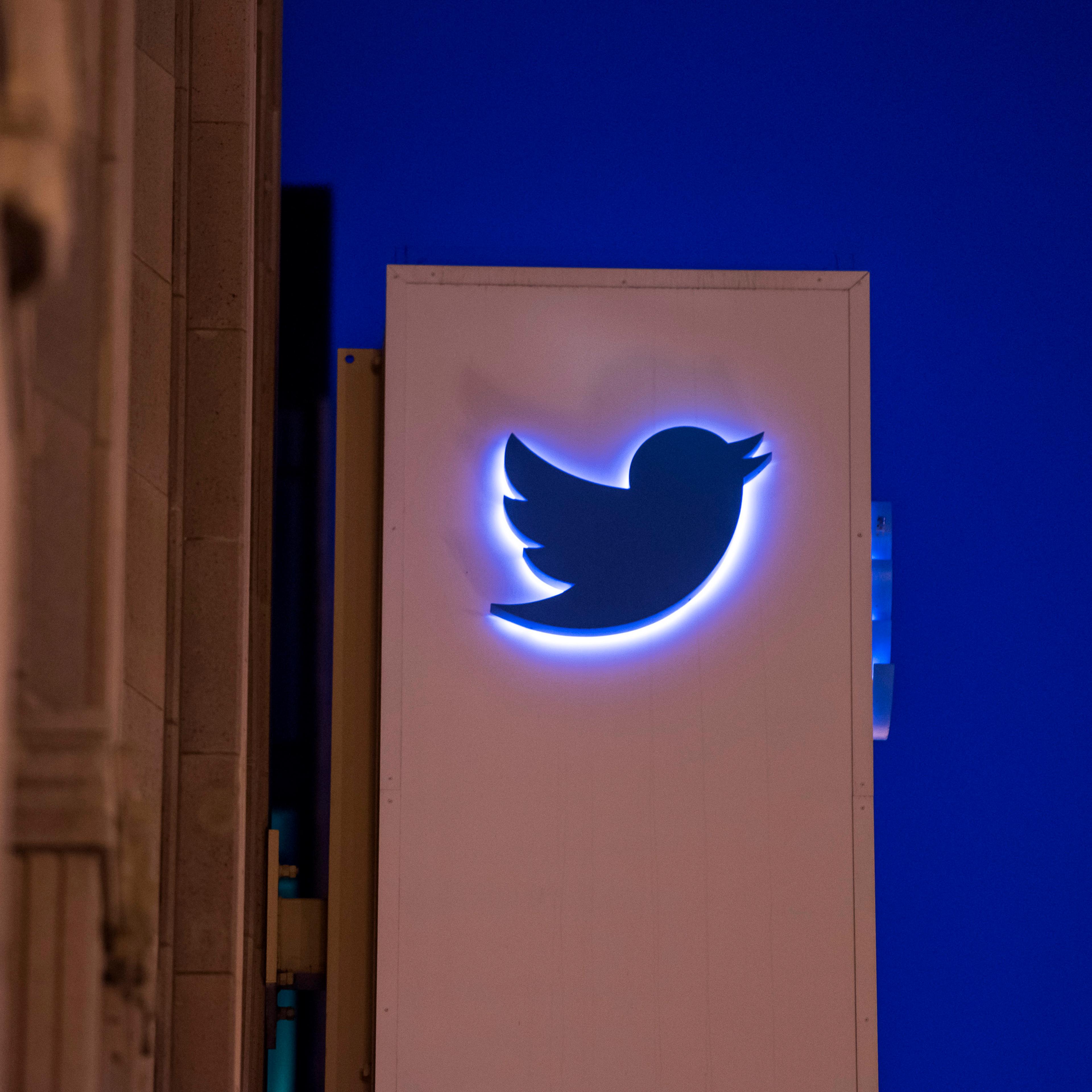The Twitter Inc. logo and signage is displayed on the facade of the company's headquarters in San Francisco, California, U.S., on Wednesday, Oct. 21, 2015. Twitter Inc. is expected to release earnings figures on Oct. 27. Photographer: David Paul Morris/B