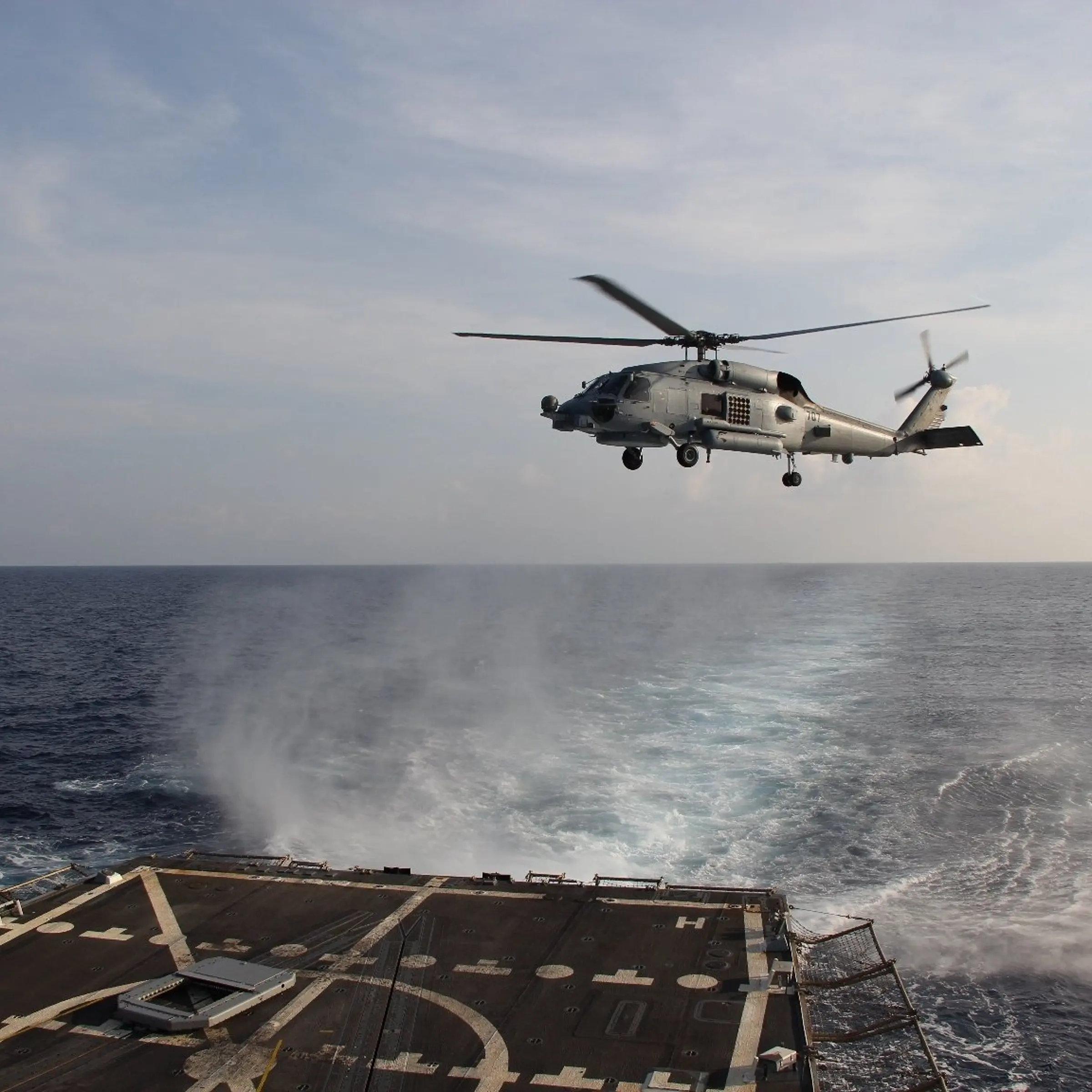 A Sea Hawk helicopter departs from USS Pinckney to search for the missing Malaysia Airlines flight on March 9, 2014.