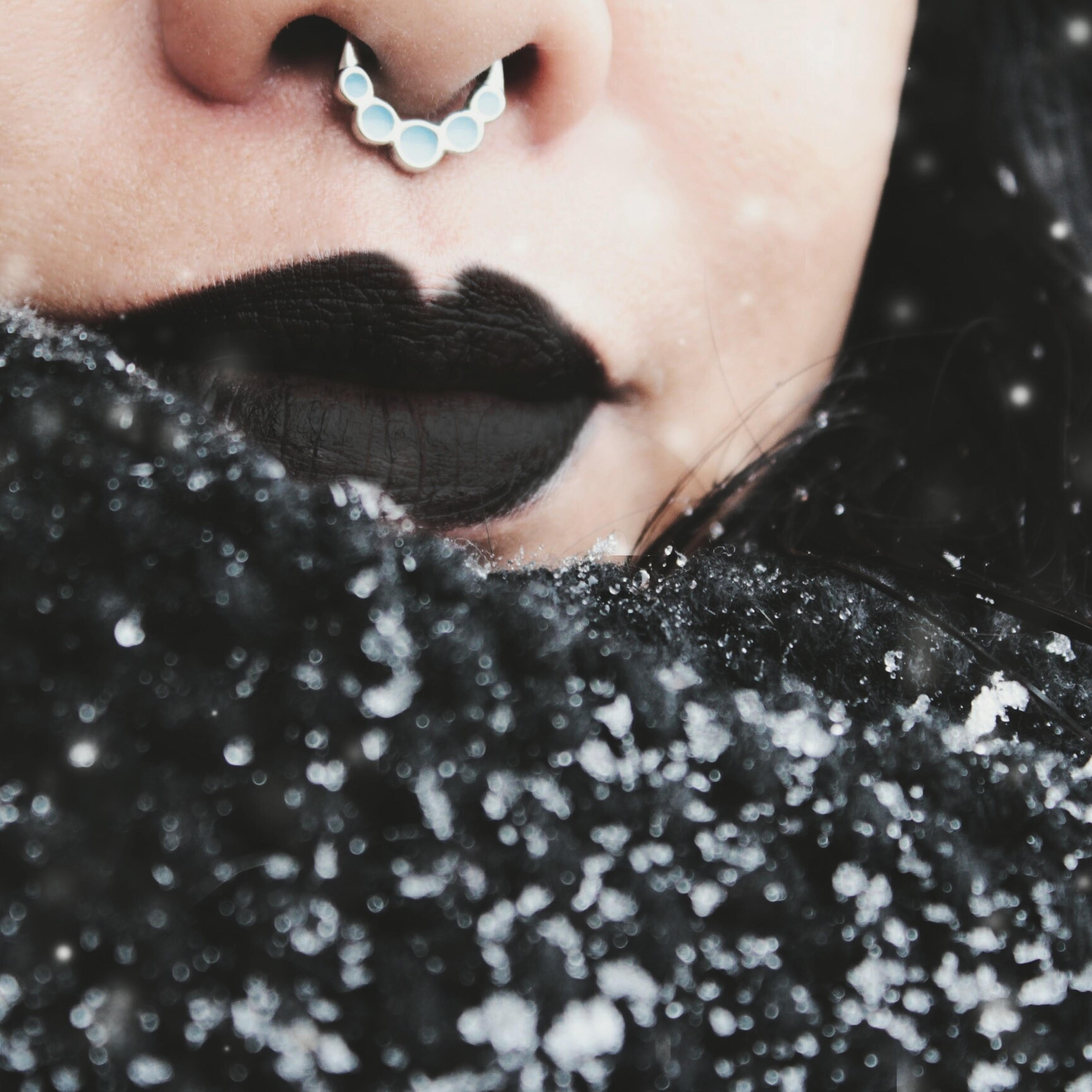 Cropped Image Of Woman With Black Lipstick During Snowfall