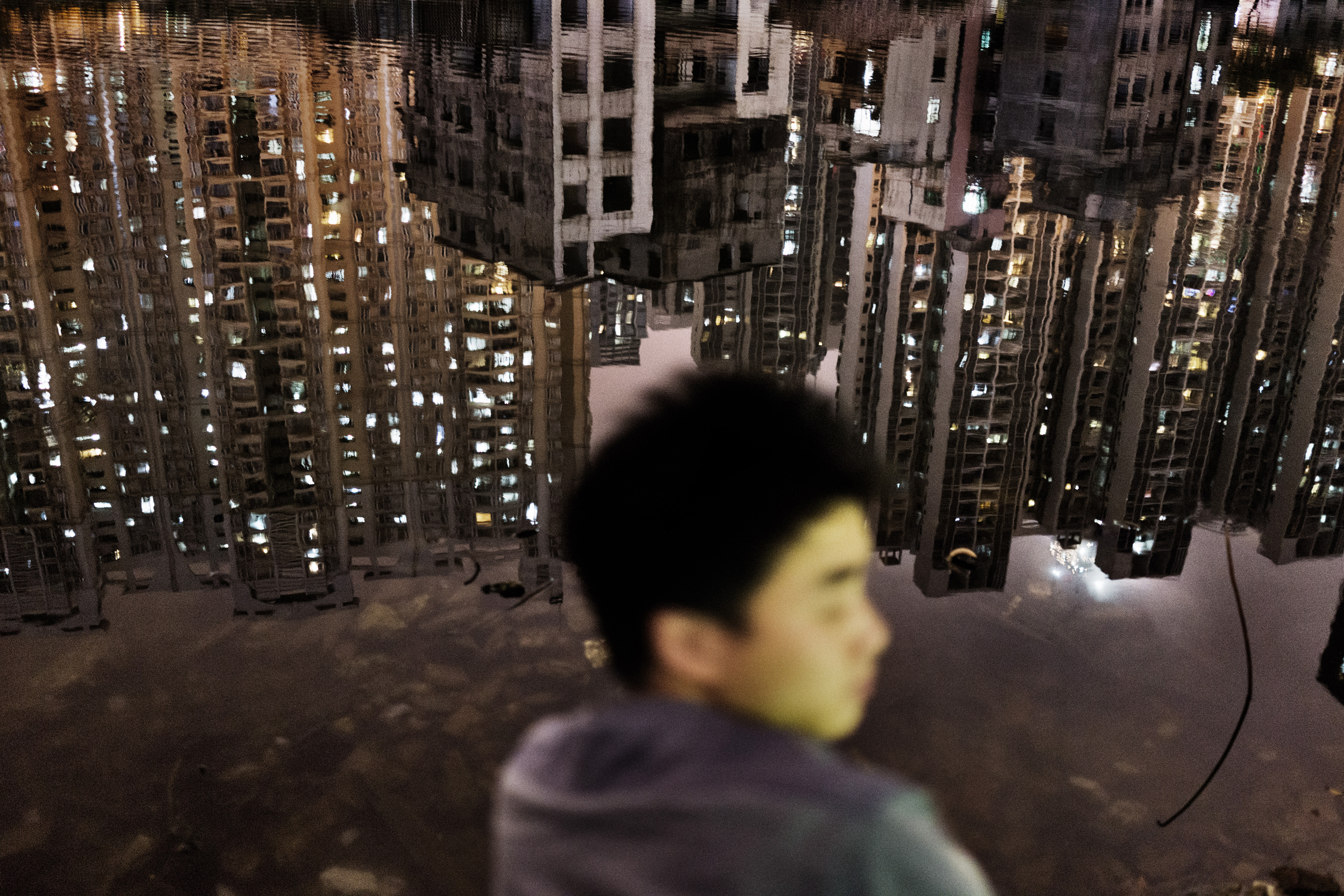 China/personal project/[Sub/Urban]/on-going/ March 2014/Urbanisation/Guangzhou/picture by Sim Chi Yin / VII Stuck in a moment: In the middle of what is Guangzhou's new Central Business District, this one-time fishing village now lies in a half-demolished