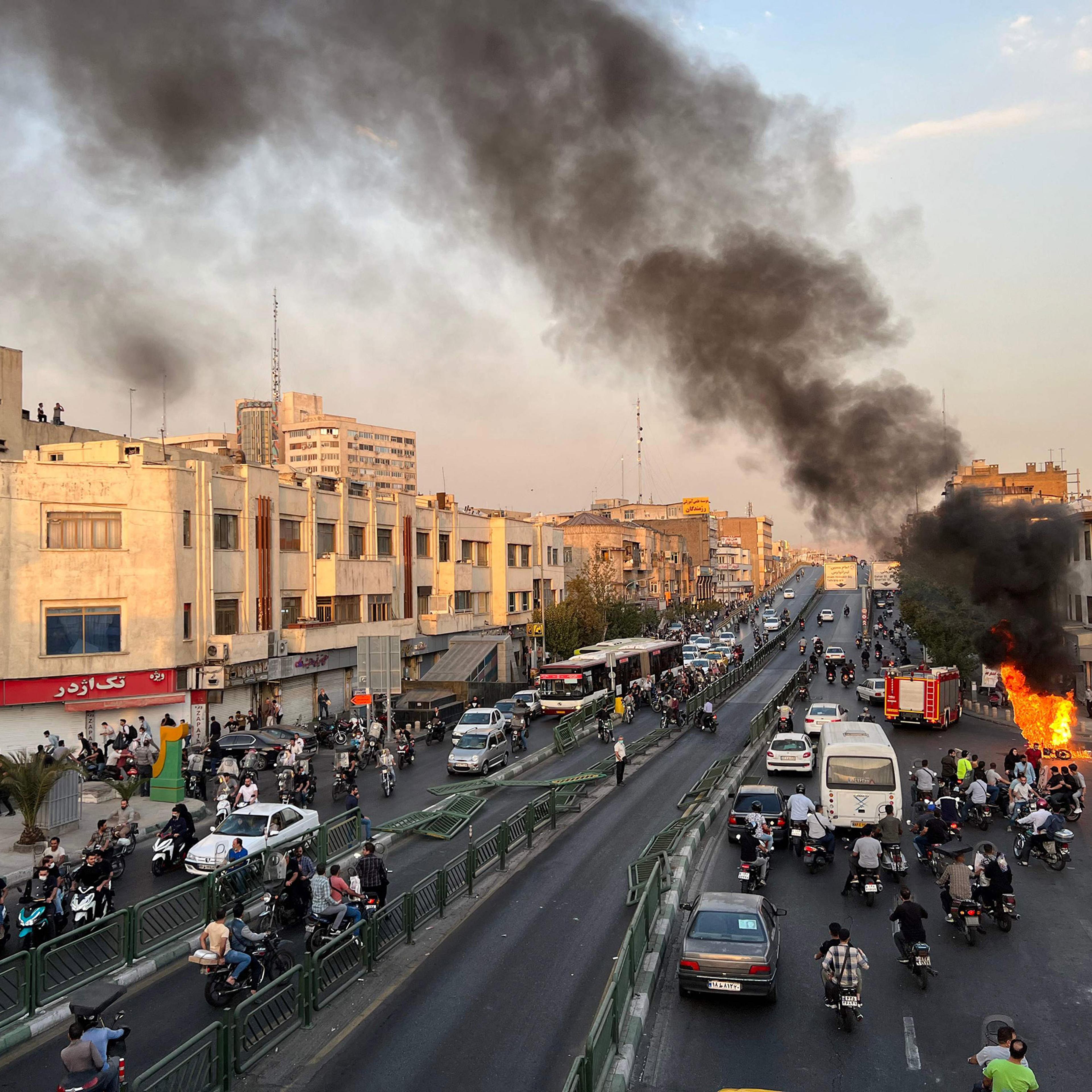 A motorcycle on fire in Iran's capital Tehran on Oct. 8, 2022, amid the biggest wave of social unrest in almost three years