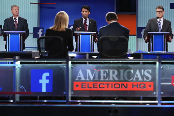 Republican presidential candidates (L-R) Sen. Lindsey Graham (R-SC), Louisiana Gov. Bobby Jindal and Rick Perry participate in a presidential pre-debate forum hosted by FOX News and Facebook at the Quicken Loans Arena August 6, 2015 in Cleveland, Ohio.