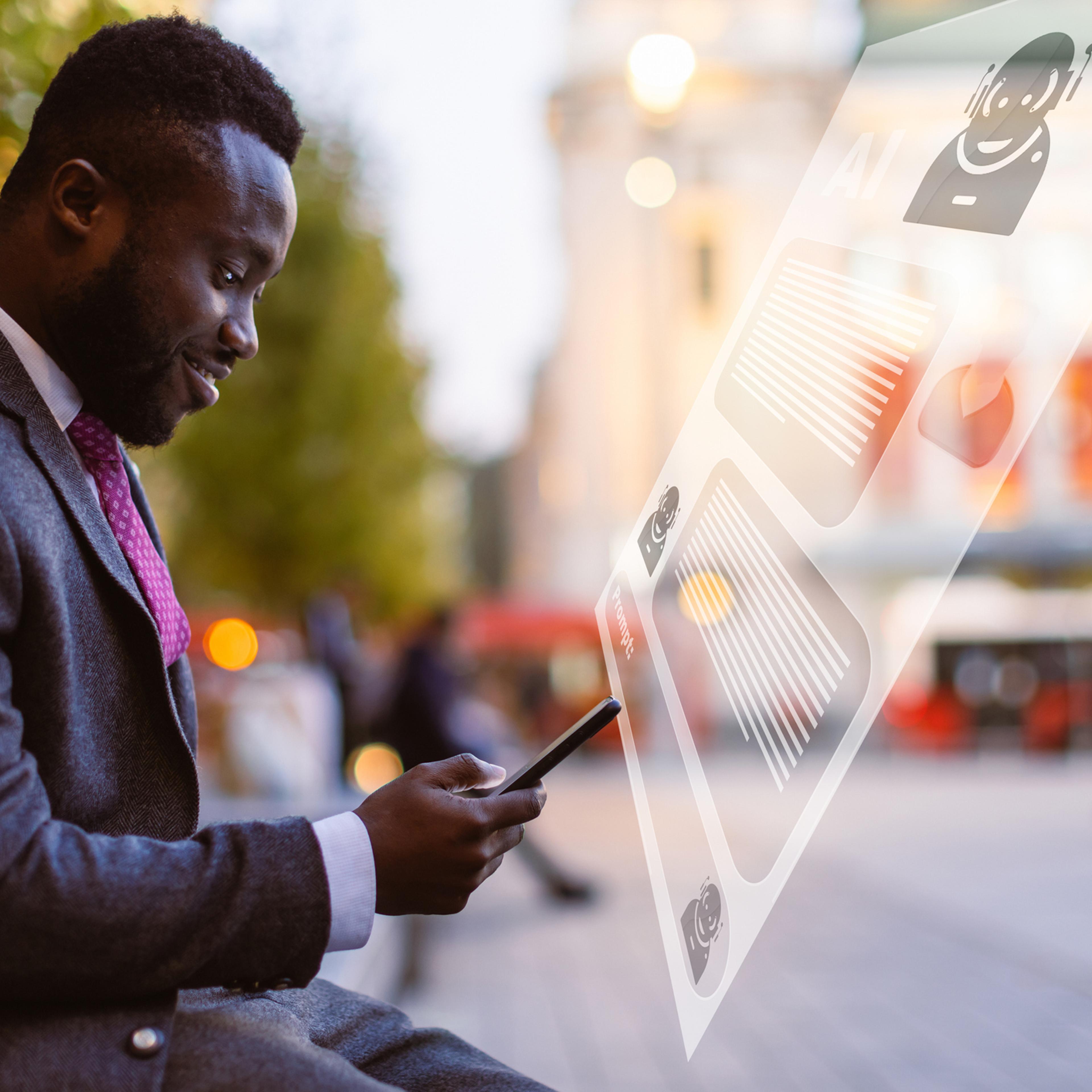 Black businessman using chatbot AI app on mobile phone