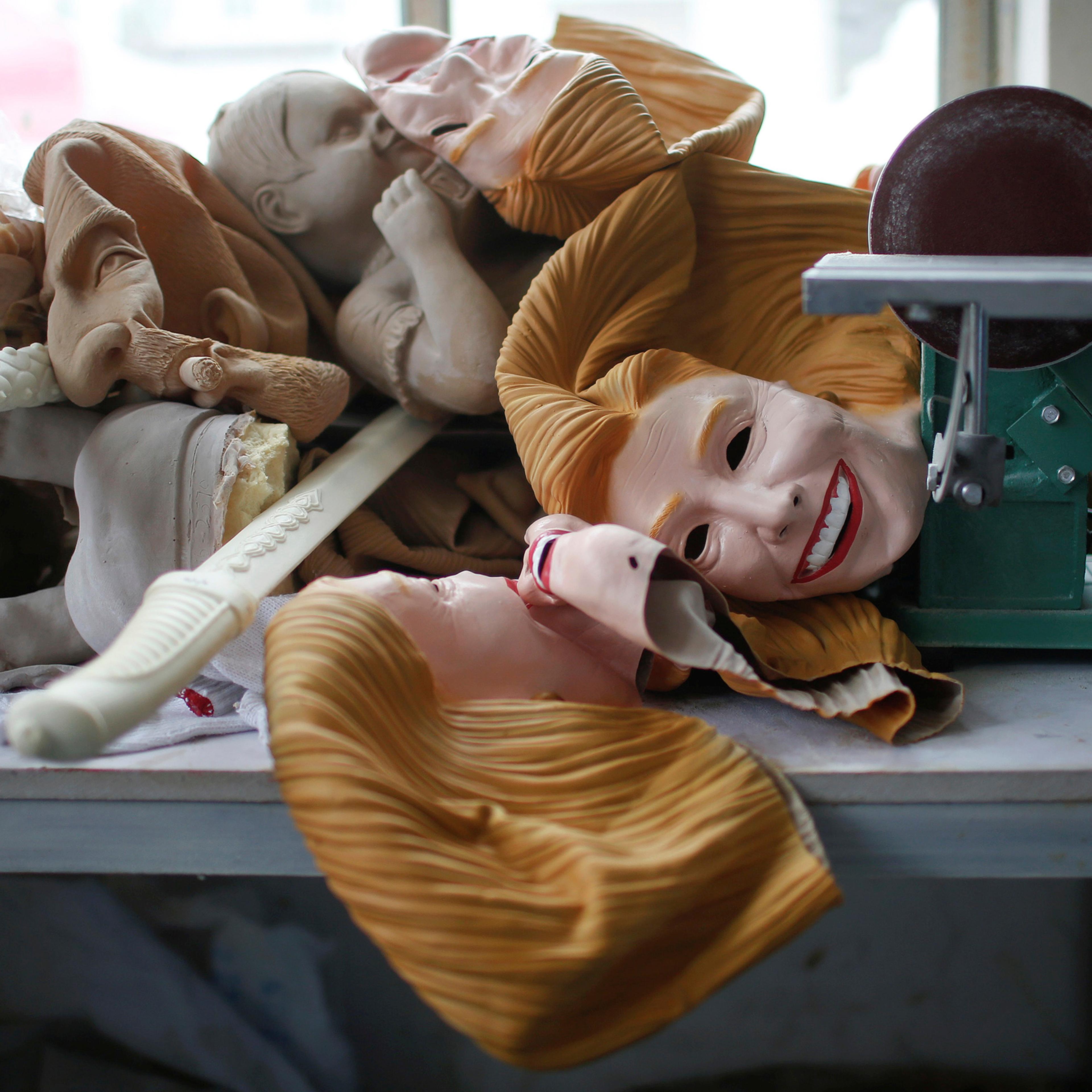 Masks, including some of Democratic presidential candidate Hillary Clinton, are seen at Jinhua Partytime Latex Art and Crafts Factory in Jinhua, Zhejiang Province, China, May 25, 2016.