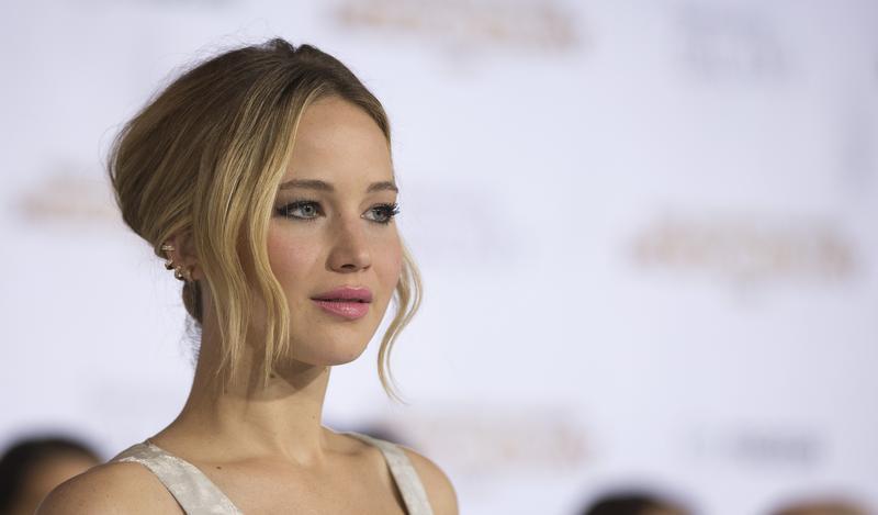 Cast member Lawrence poses at the premiere of "The Hunger Games: Mockingjay - Part 1" in Los Angeles