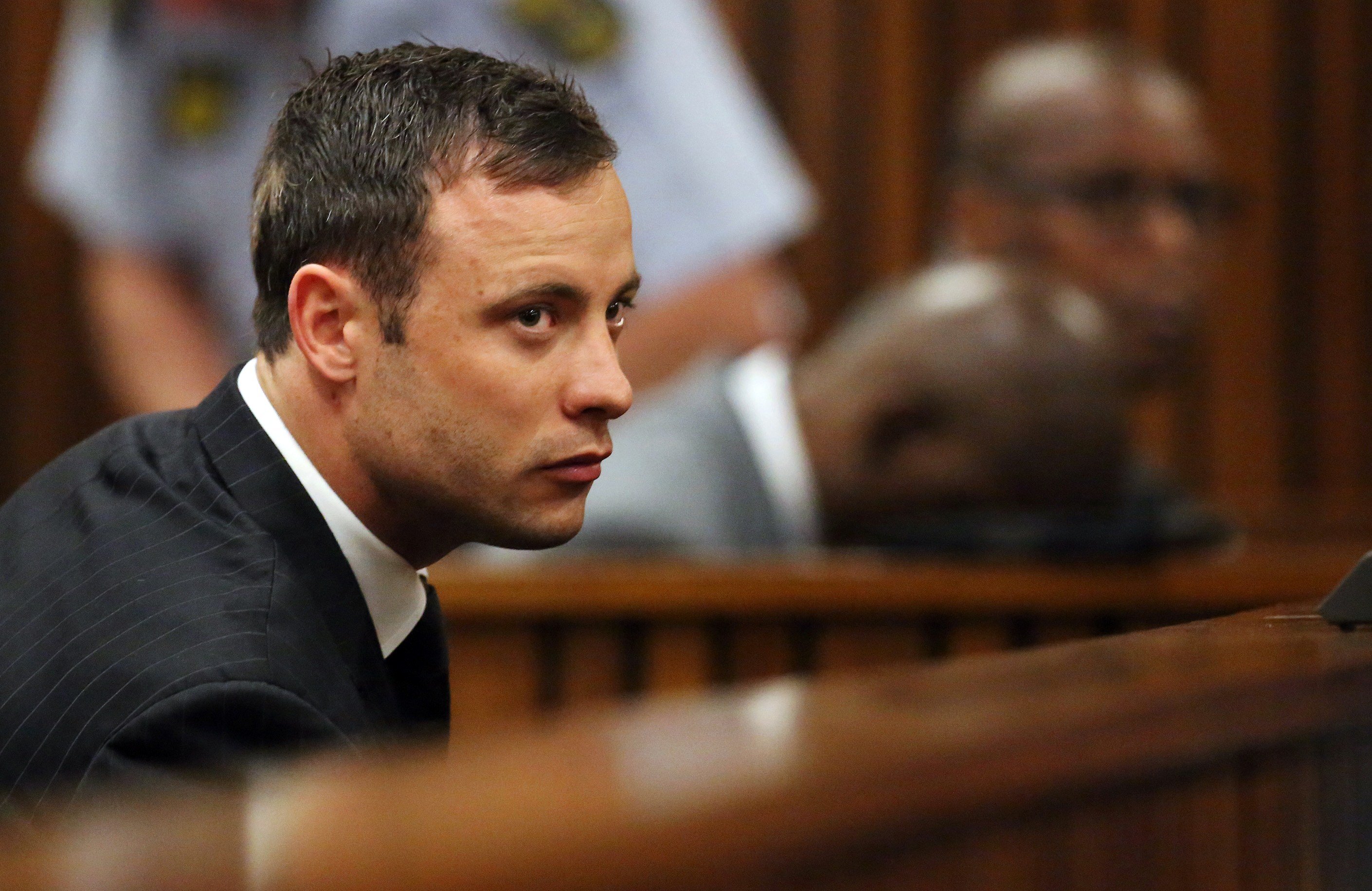 Oscar Pistorius listens to the verdict in his murder trial in the High Court in Pretoria on September 12, 2014.