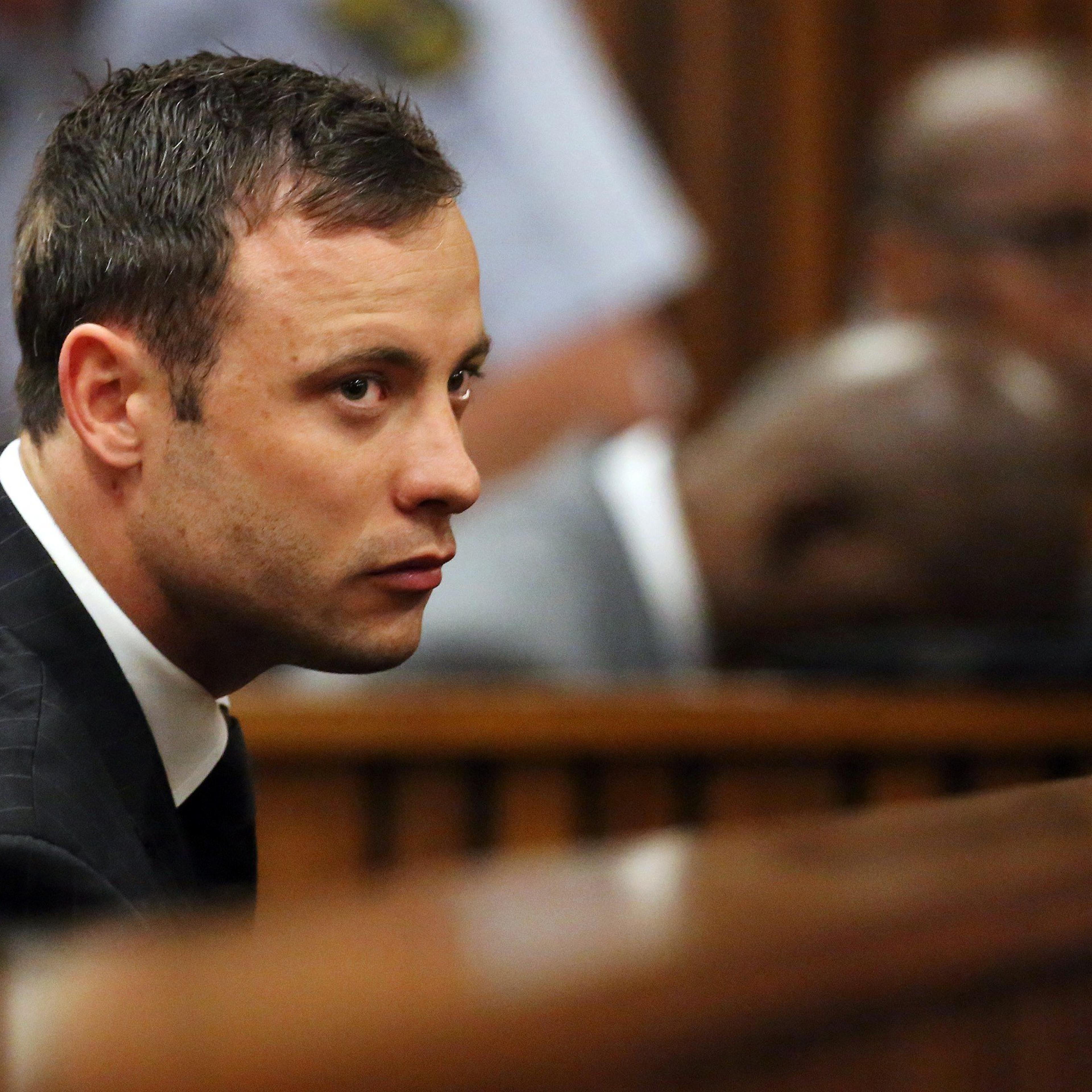 Oscar Pistorius listens to the verdict in his murder trial in the High Court in Pretoria on September 12, 2014.