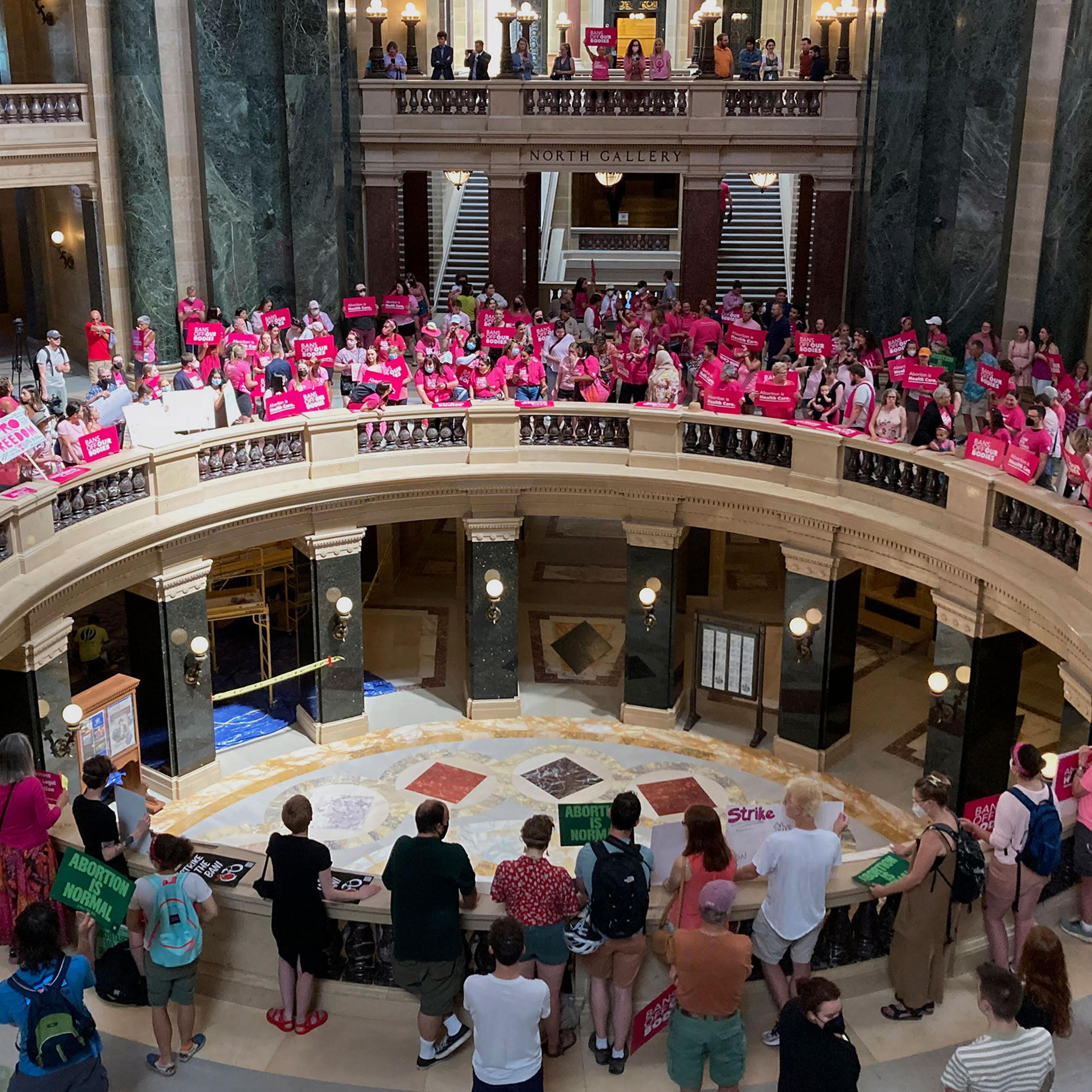 Dozens of protesters gather in the Wisconsin state Capitol rotunda in Madison, Wis., on June 22, 2022, in hopes of convincing Republican lawmakers to repeal the state's 173-year-old ban on abortions.