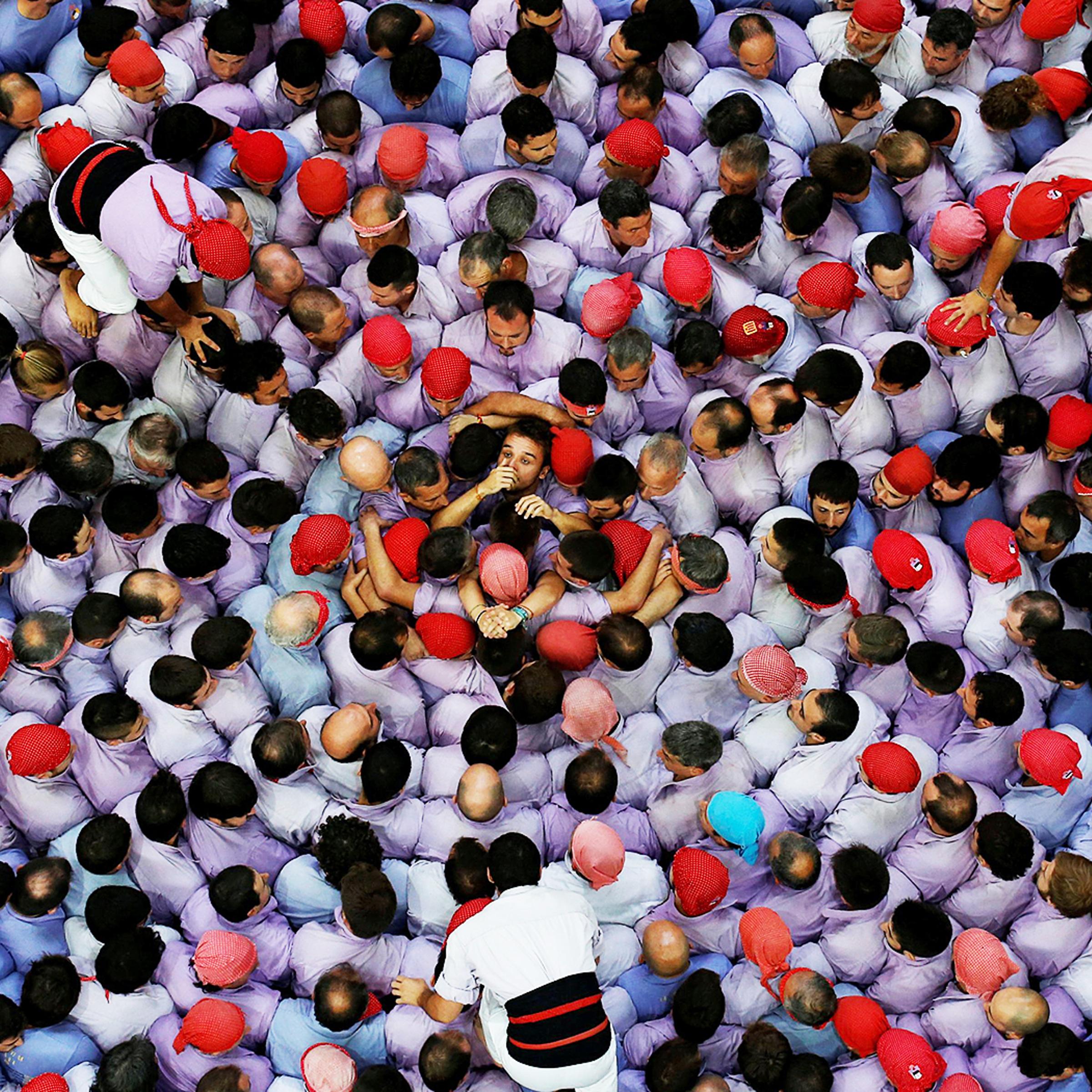 Colla Jove Xiquets de Tarragona start to form a human tower called "castell" during a biannual competition in Tarragona