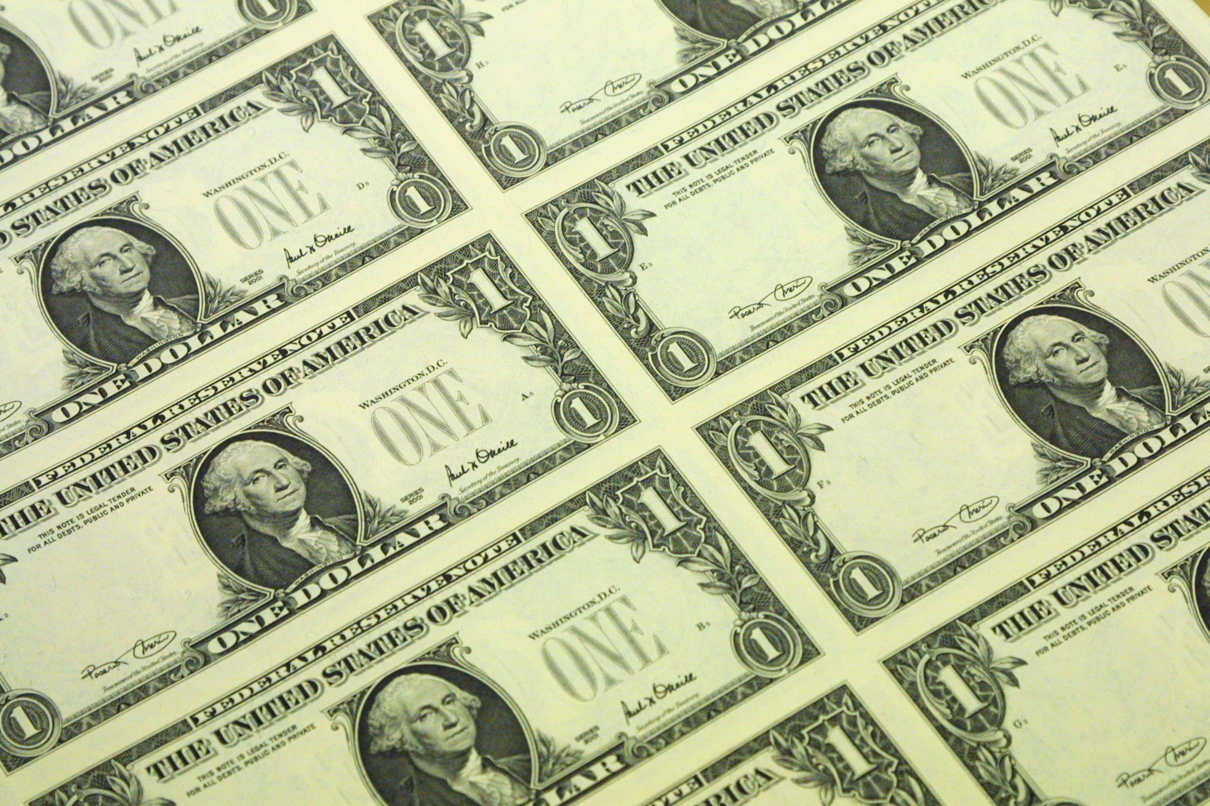 An uncut sheet of the new Series 2001 one dollar bill notes is stored Nov. 21, 2001 at the Bureau of Engraving and Printing in Washington, DC. 