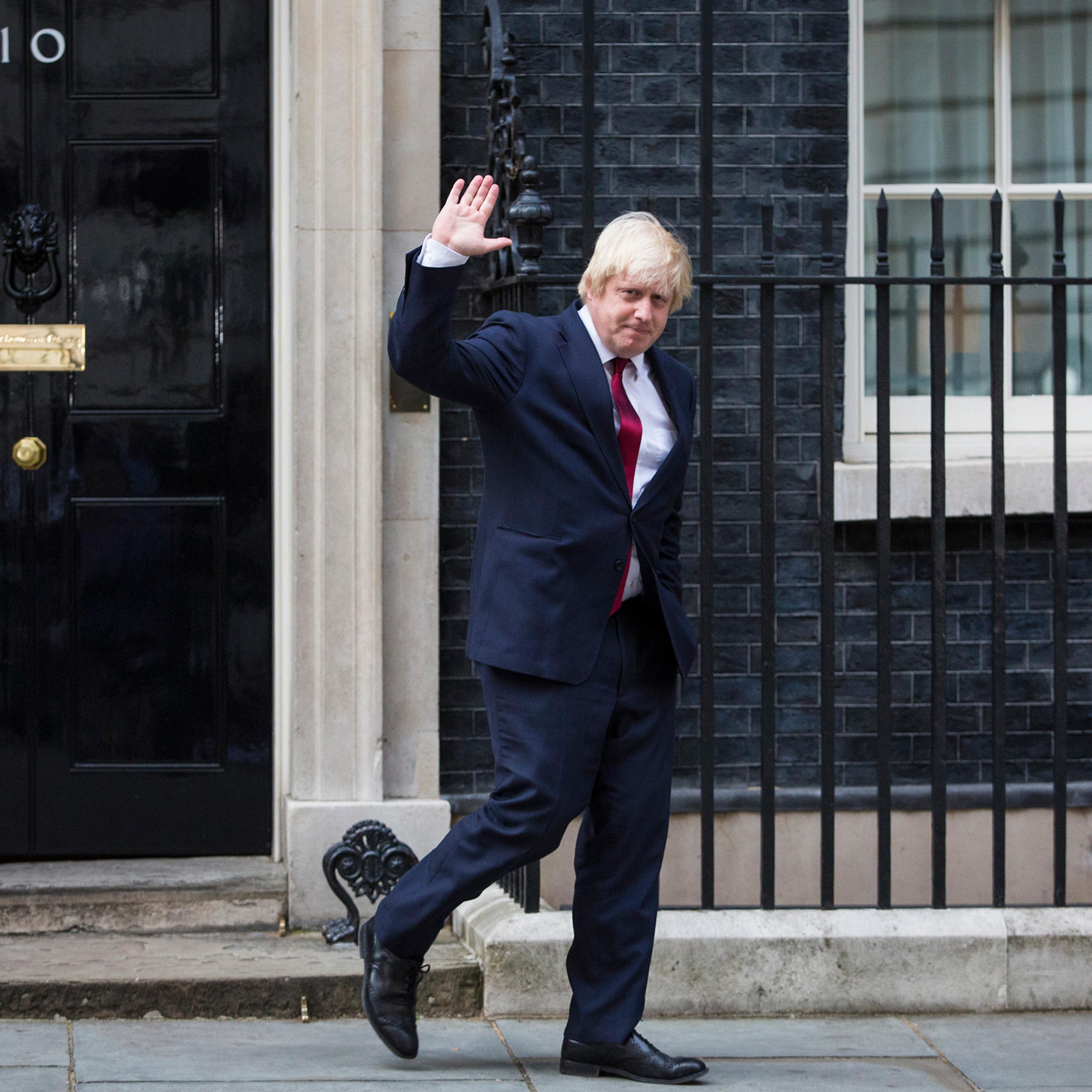 Boris Johnson waves as he leaves Downing Street after being appointed Foreign Secretary in London, July 13, 2016.