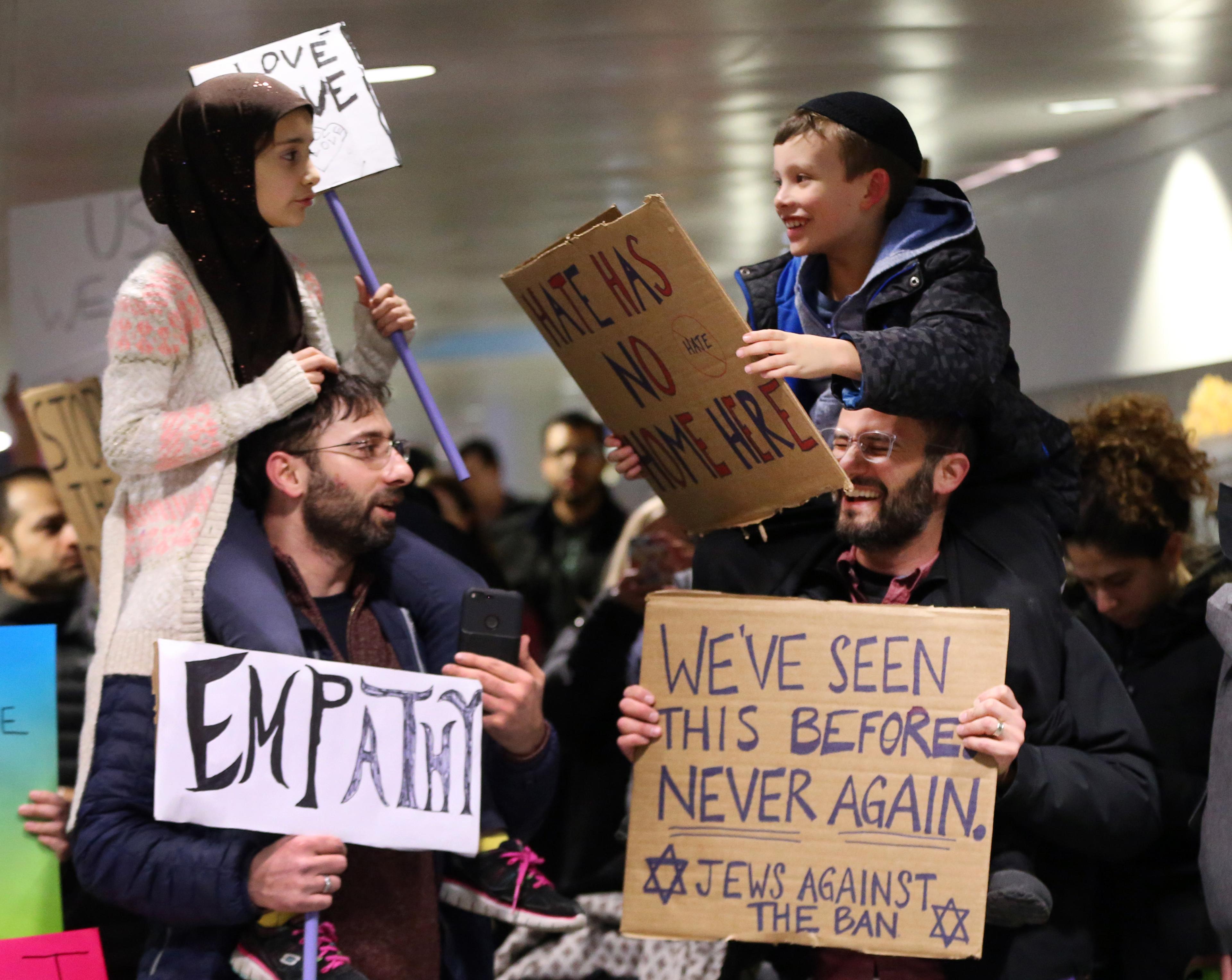 Protesters gather at O'Hare airport after travelers held