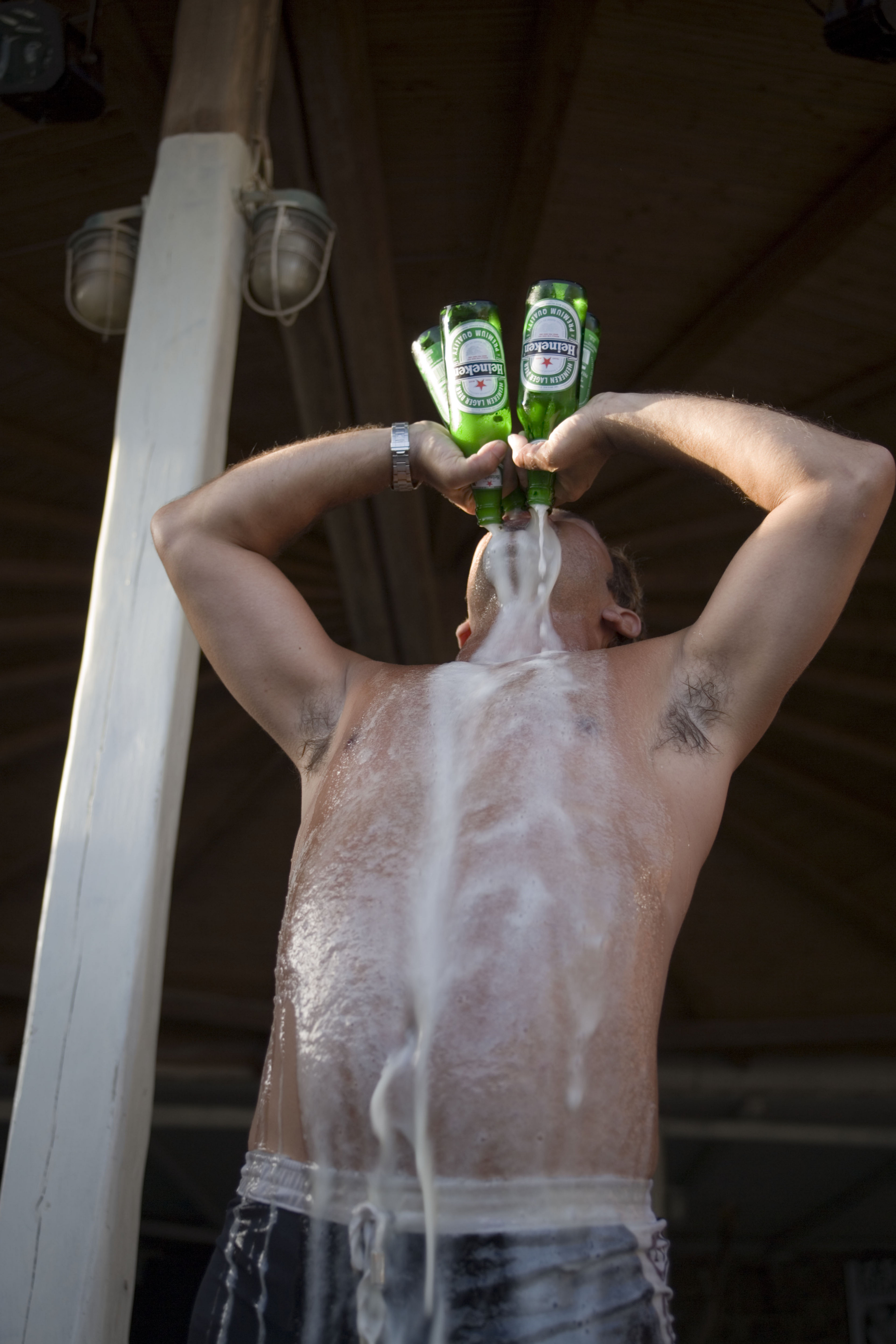 man drinking four beers