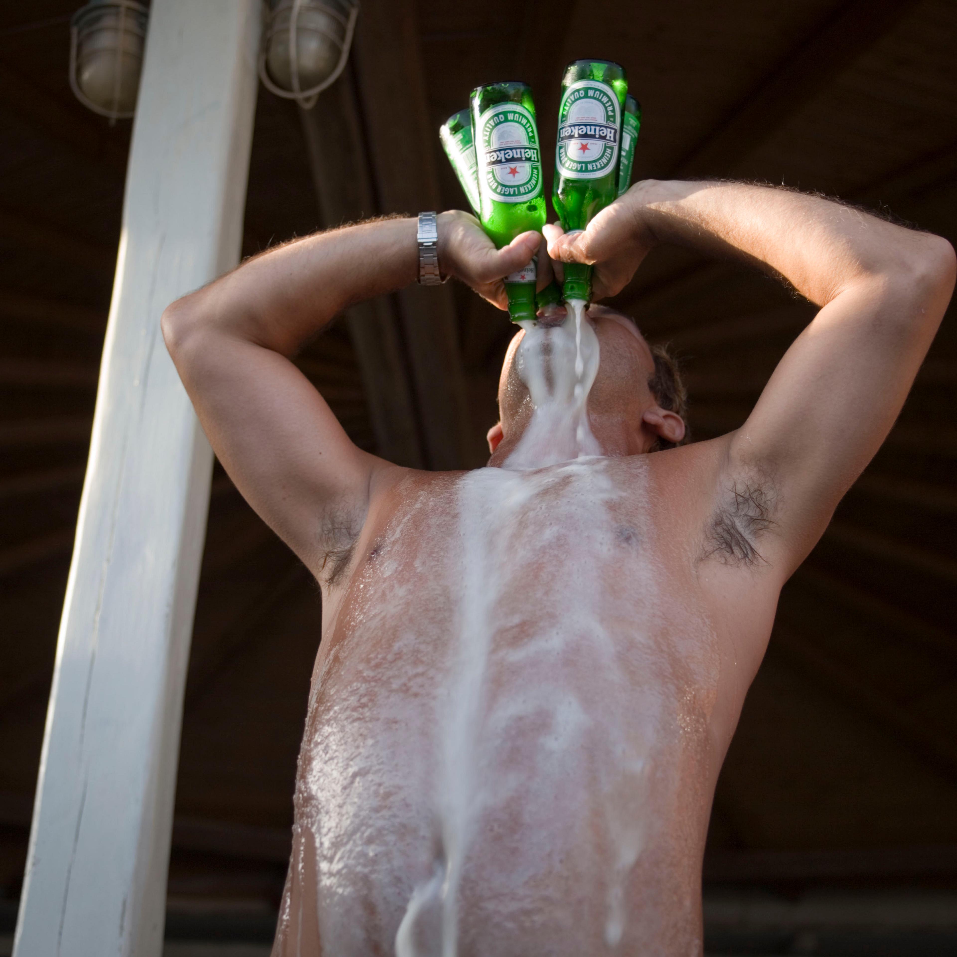 man drinking four beers