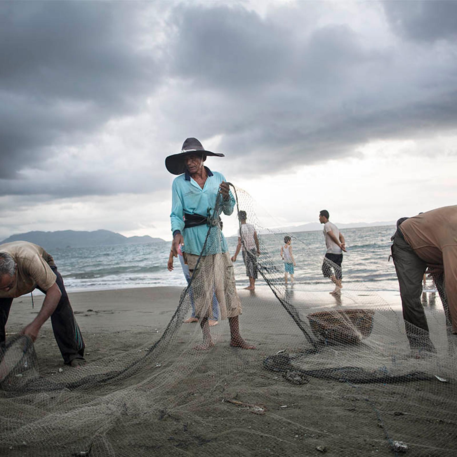 Fishermen at work on a beach outside Banda Aceh, Indonesia, on Nov. 17, 2014