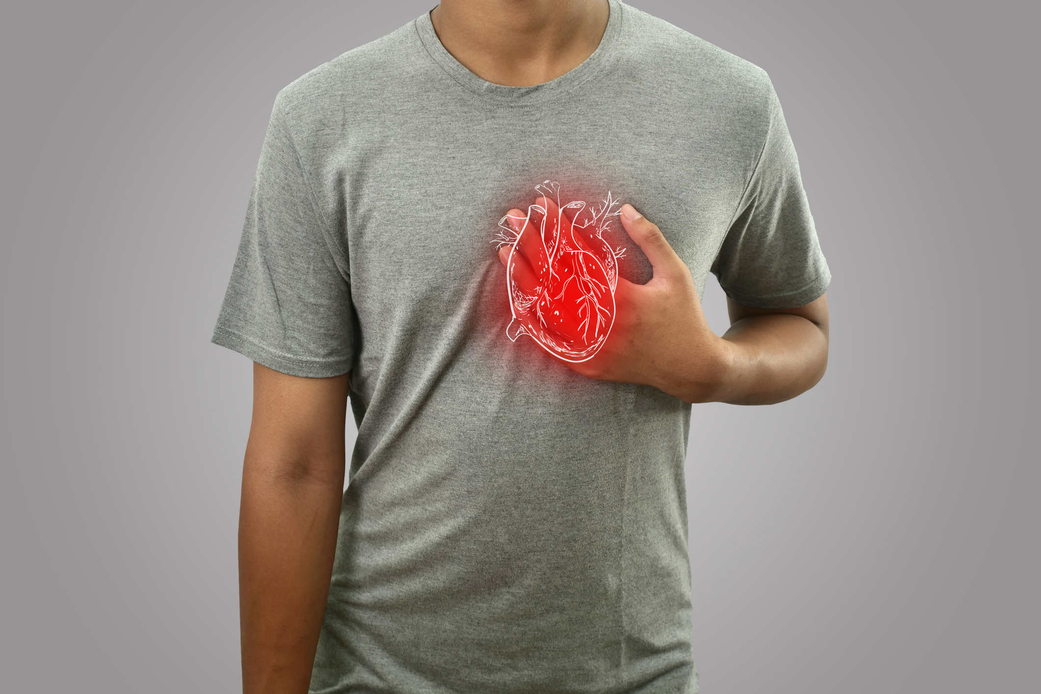 Digital composition of human heart with highlighted red inflammation on sick person, man with chest pain