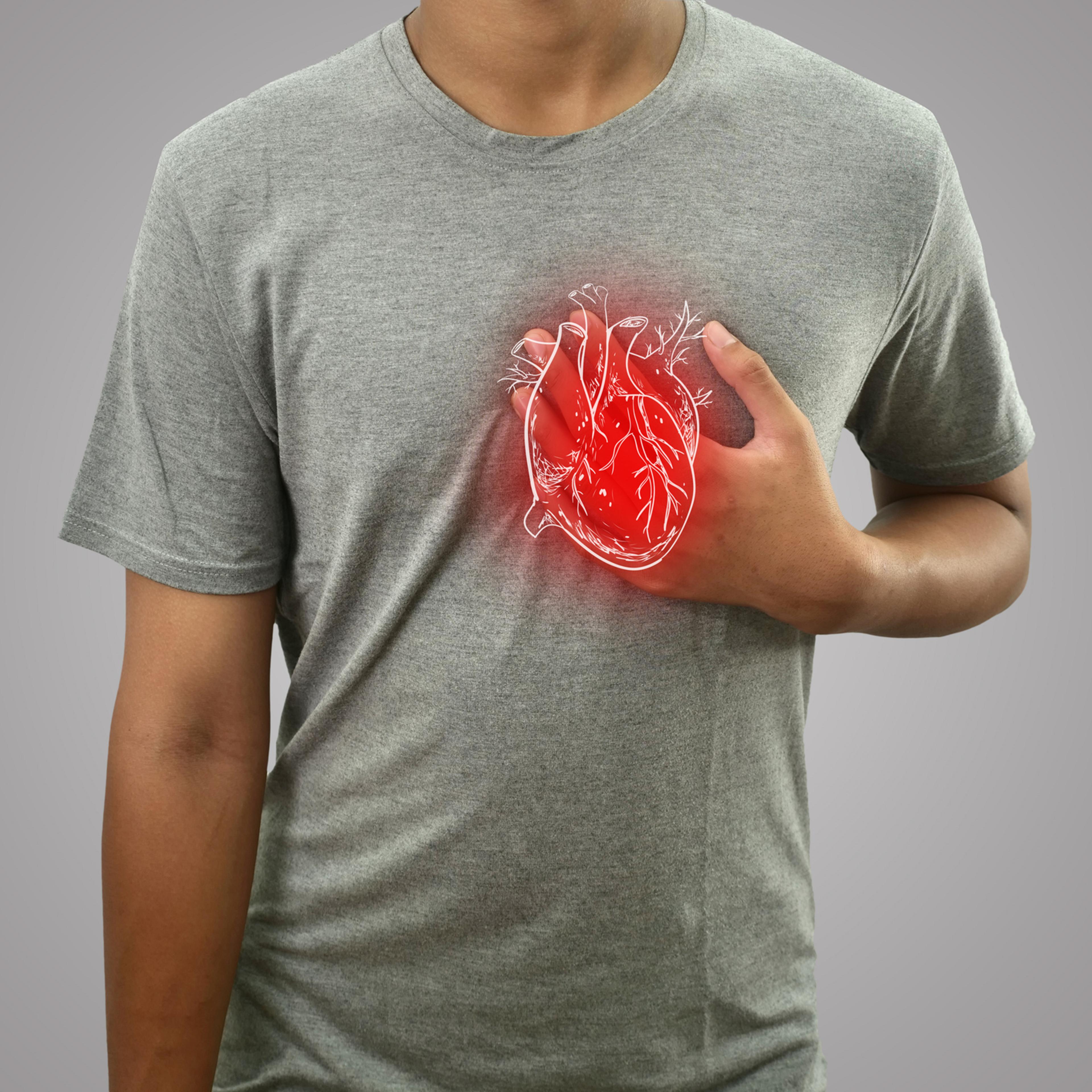 Digital composition of human heart with highlighted red inflammation on sick person, man with chest pain