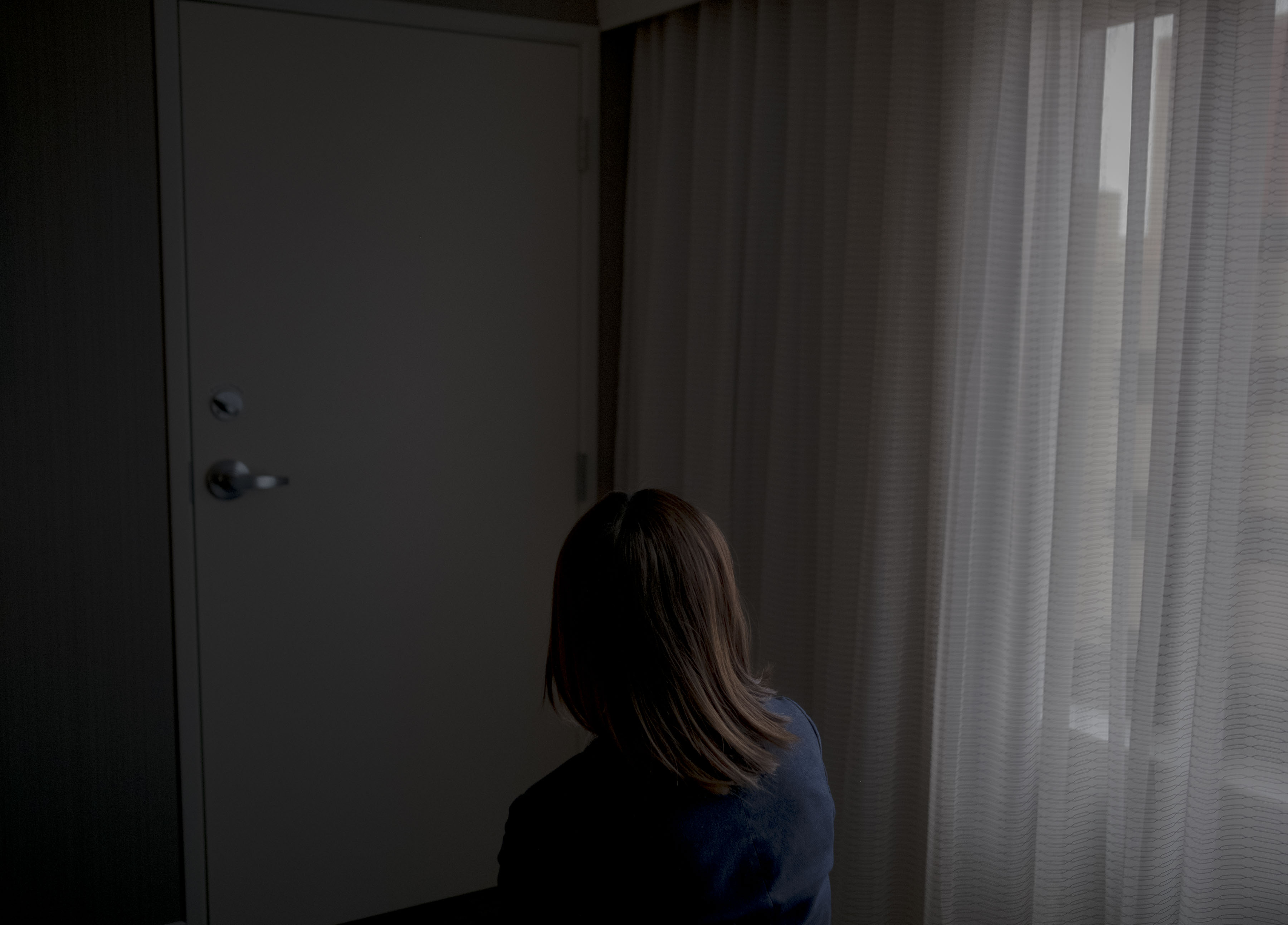 2/25/20, Gaithersburg, Md. Emma, a human trafficking survivor from China, in a hotel room in Gaithersburg, Md. on Feb. 25, 2020. Gabriella Demczuk / TIME