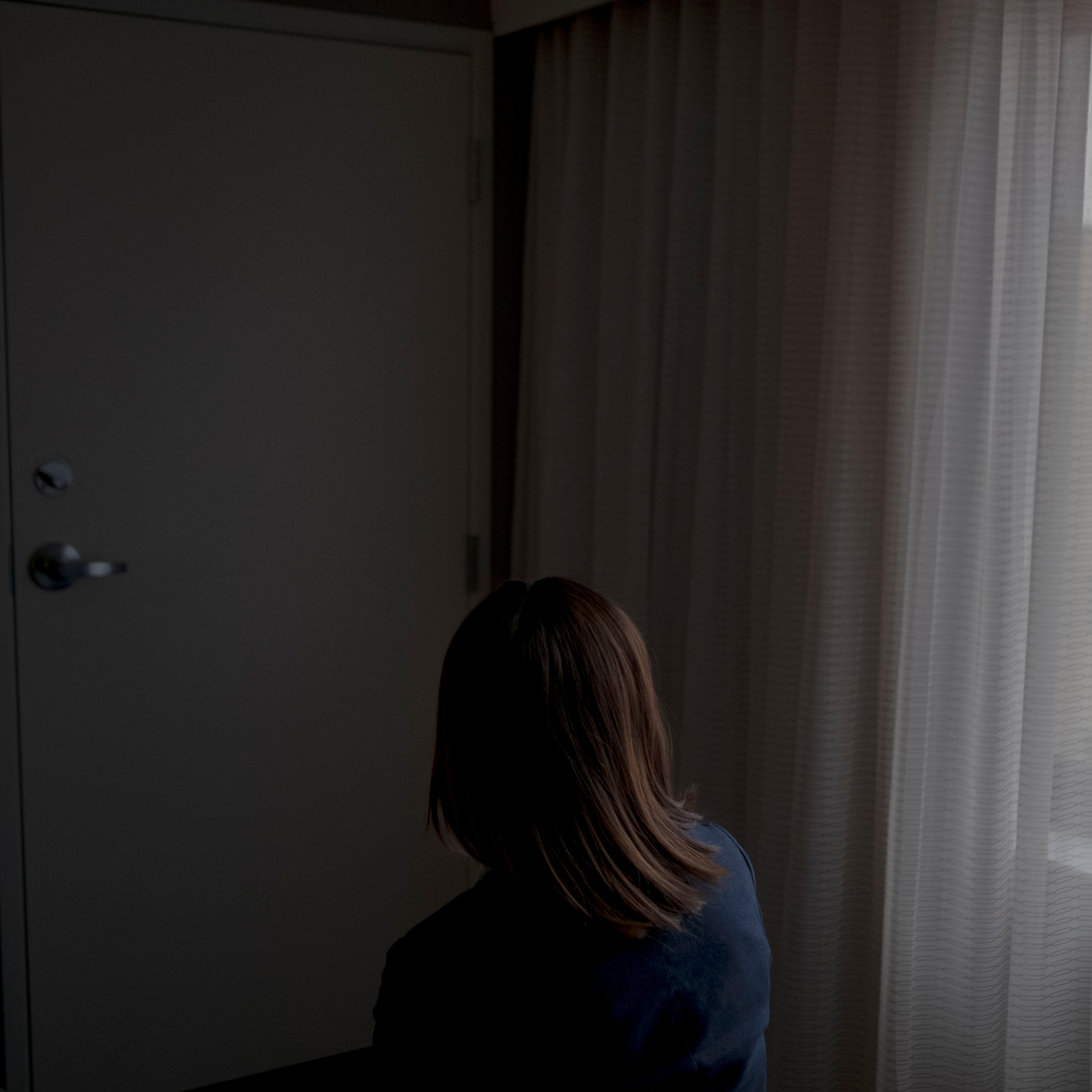 2/25/20, Gaithersburg, Md. Emma, a human trafficking survivor from China, in a hotel room in Gaithersburg, Md. on Feb. 25, 2020. Gabriella Demczuk / TIME