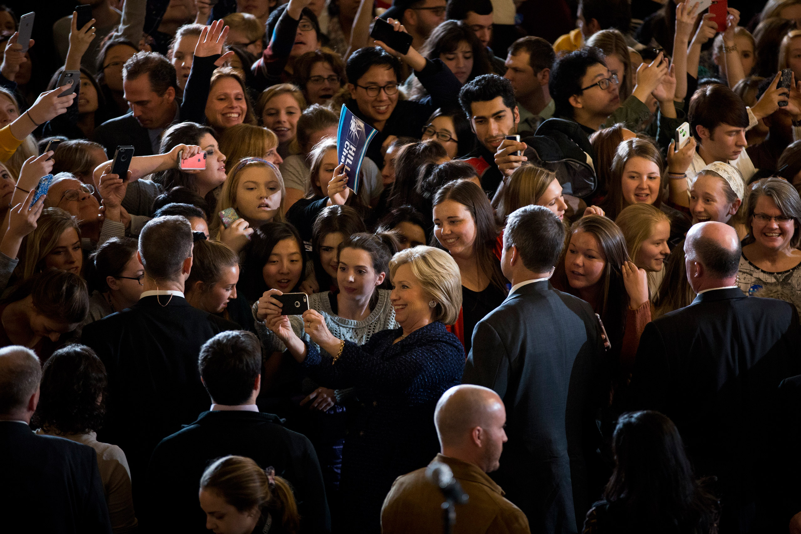 Democratic presidential candidate Hillary Clinton, center, takes a selfie with students during a rally on the campus of University of Iowa Thursday, Jan. 21, 2016, in Iowa City, Iowa. (AP Photo/Jae C. Hong)