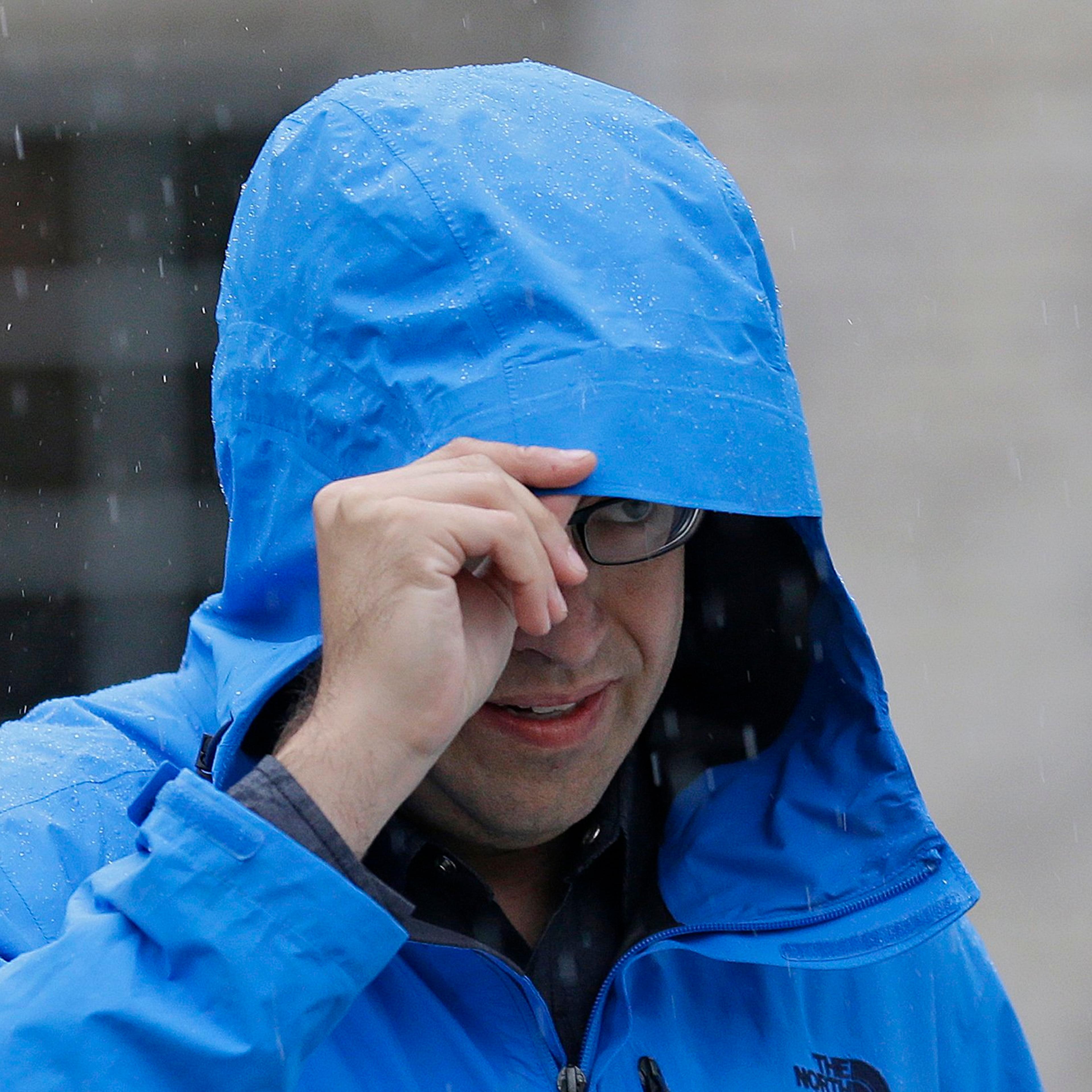 Subway restaurant spokesman Jared Fogle walks to a waiting car as he leaves his home on July 7, 2015, in Zionsville, Ind.