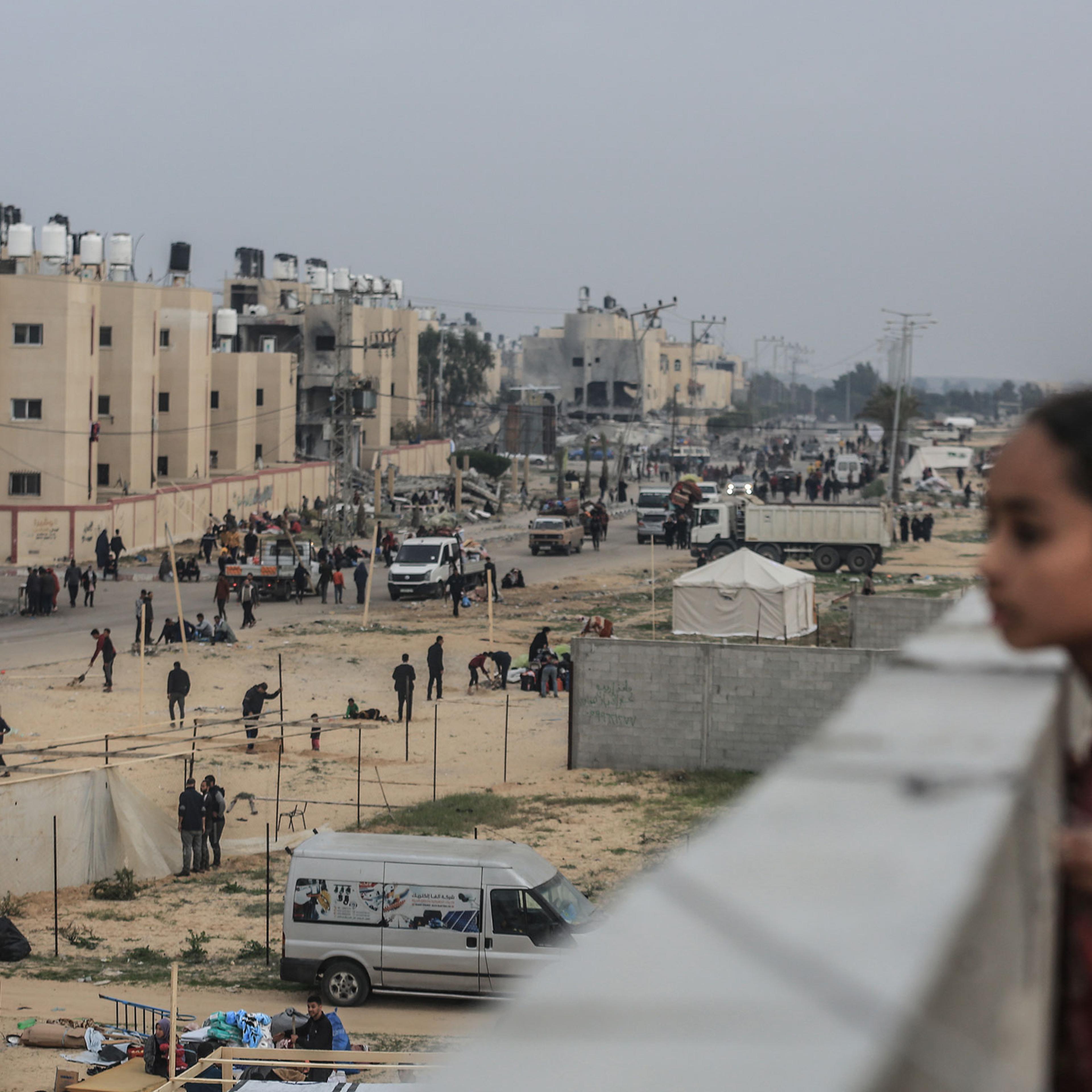 Palestinians set up tents near the Egyptian border in Rafah after fleeing from the city of Khan Yunis in the southern Gaza Strip, on Dec. 5, 2023.