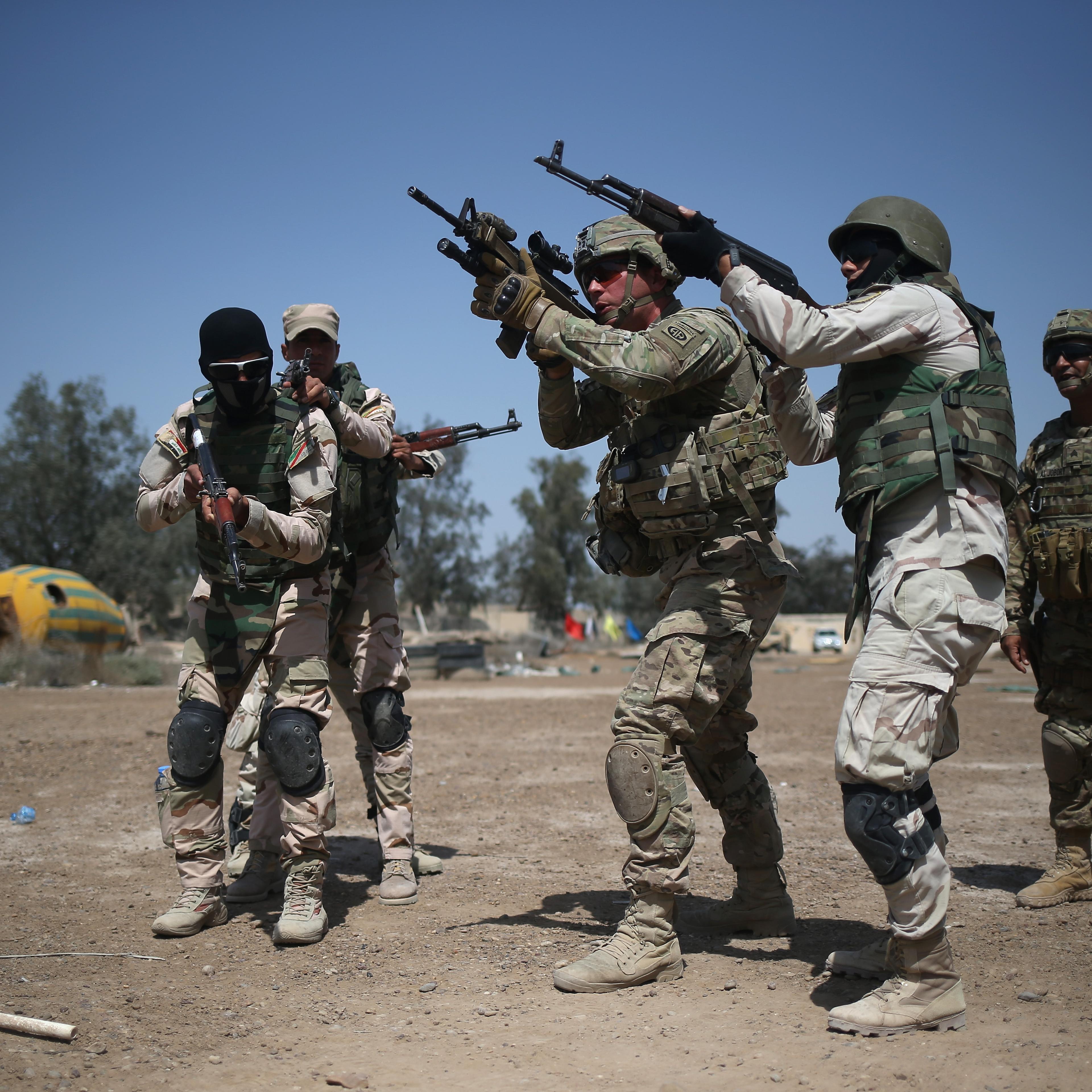 U.S. Army trainers instruct Iraqi Army recruits at a military base on April 12, 2015 in Taji, Iraq.