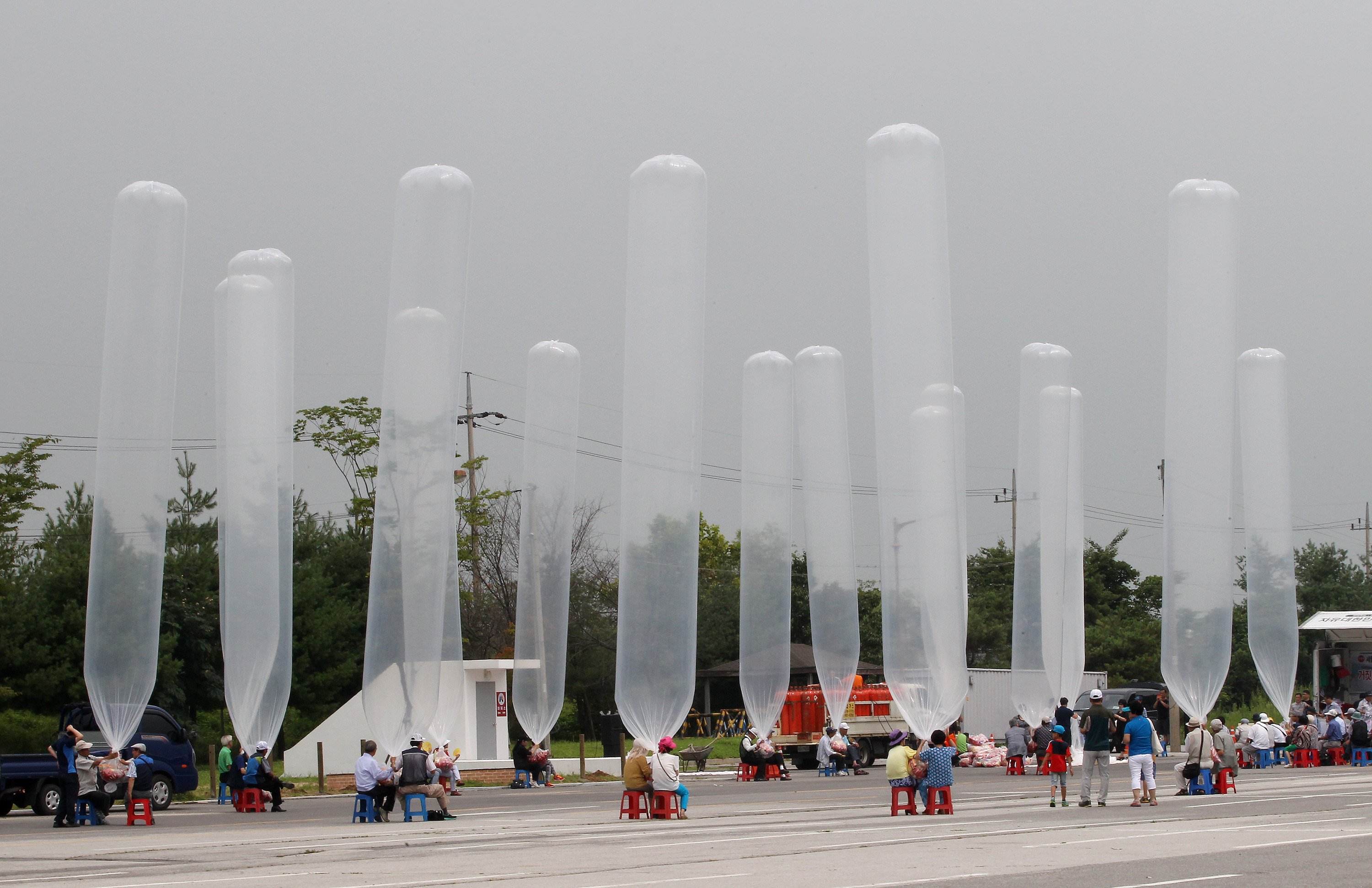 North Korean defectors and South Korean activists prepare to release balloons to let them fly to the North, carrying chocolate pies and cookies during a rally against the North's recent threat at the Imjingak Pavilion near the border village of Panmunjom