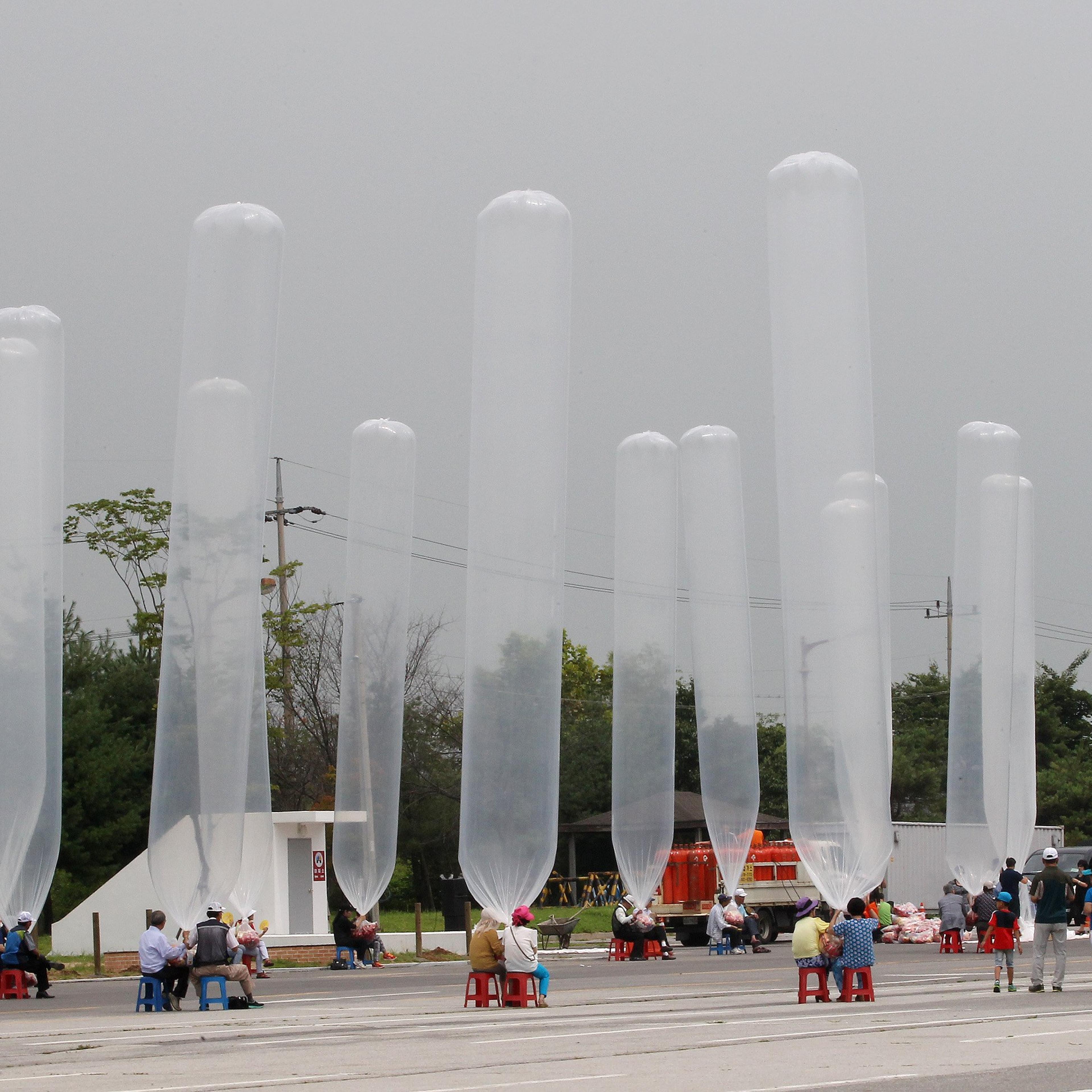 North Korean defectors and South Korean activists prepare to release balloons to let them fly to the North, carrying chocolate pies and cookies during a rally against the North's recent threat at the Imjingak Pavilion near the border village of Panmunjom