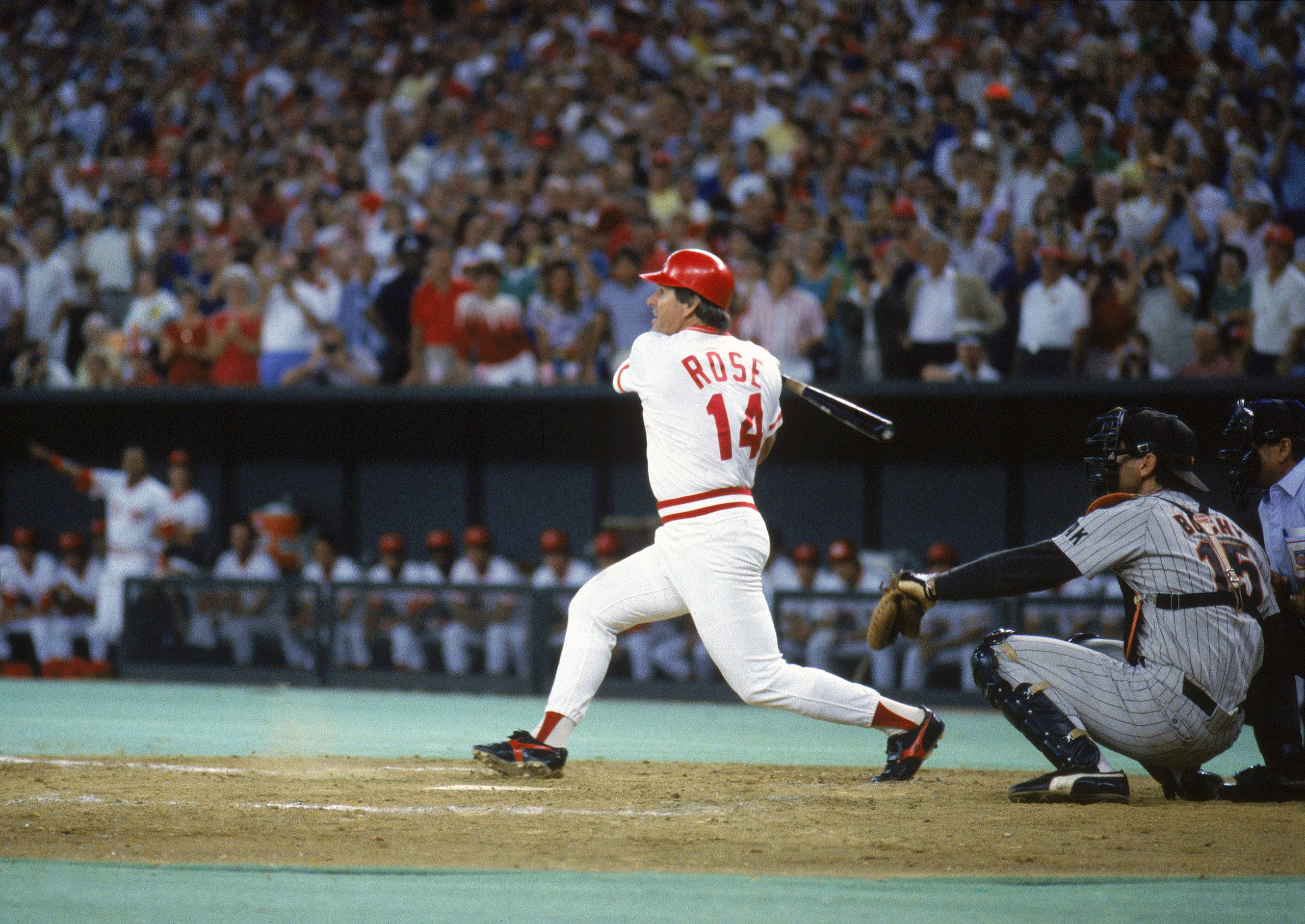 Pete Rose #14 of the Cincinnati Reds follows through with the hit against the San Diego Padres during a game on September 11, 1985 at Riverfront Stadium in Cincinnati, Ohio. Pete Rose scores his 4192 hit off of pitcher Eric Show, breaking Ty Cobb's recor