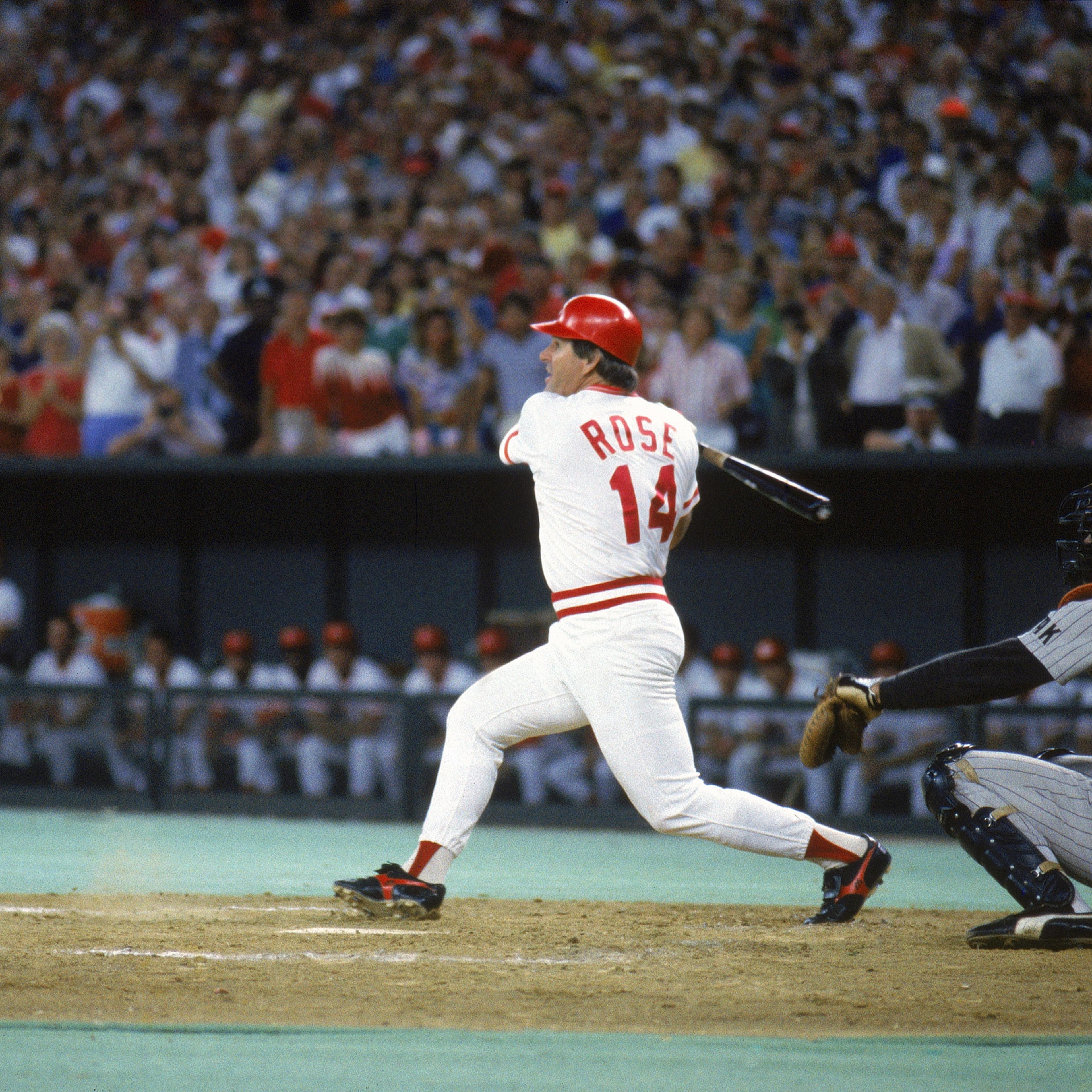 Pete Rose #14 of the Cincinnati Reds follows through with the hit against the San Diego Padres during a game on September 11, 1985 at Riverfront Stadium in Cincinnati, Ohio. Pete Rose scores his 4192 hit off of pitcher Eric Show, breaking Ty Cobb's recor