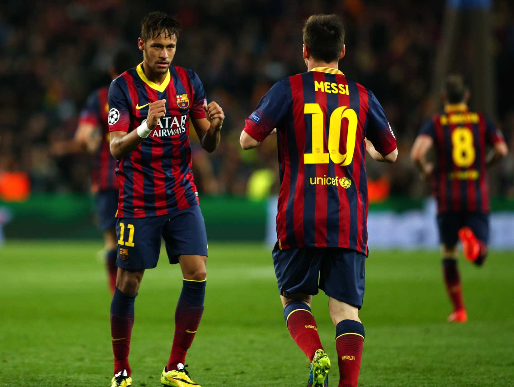 Barcelona's Neymar, left, celebrates with teammate Lionel Messi after scoring his side's first goal during a match between Barcelona and Atletico Madrid at the Camp Nou stadium in Barcelona on April 1, 2014