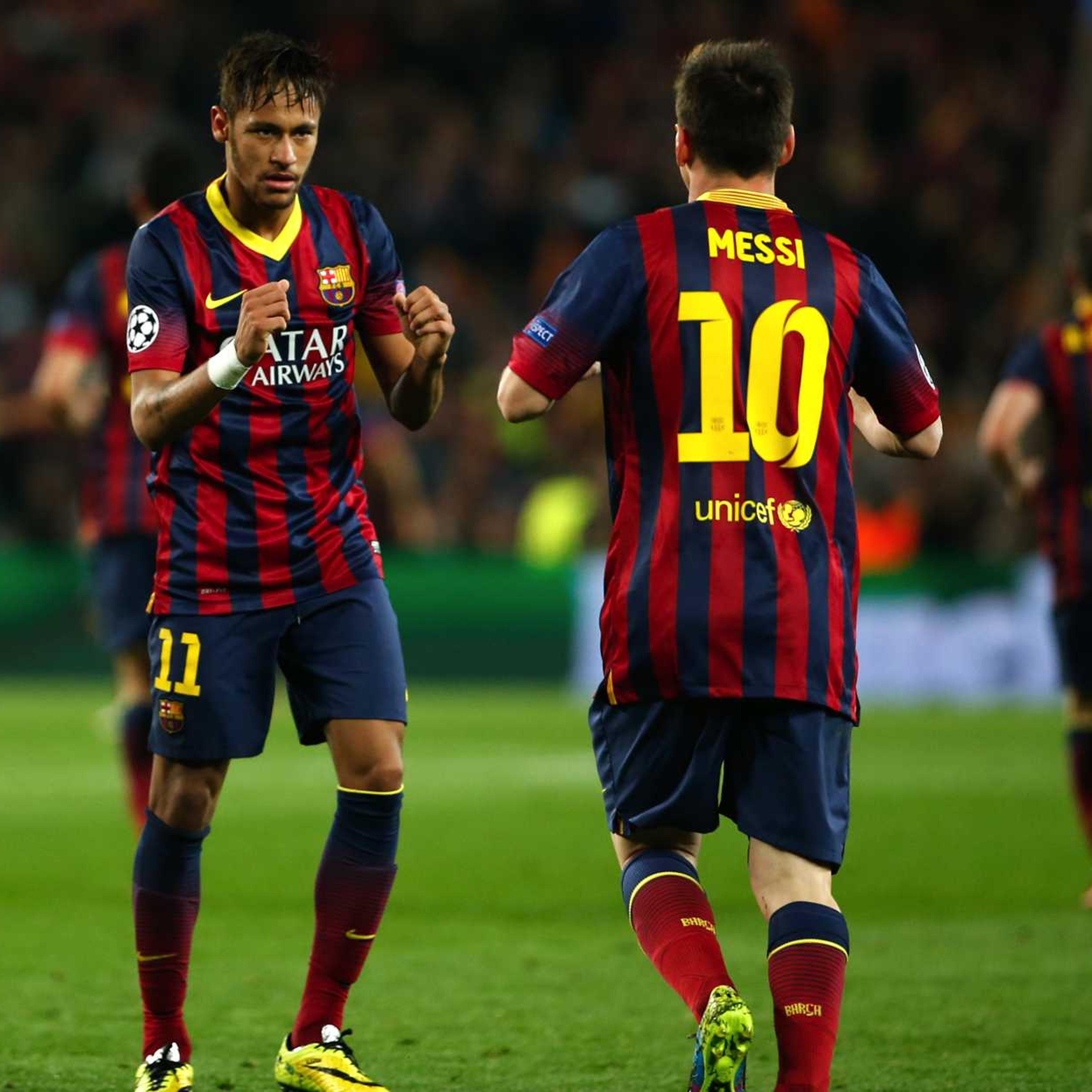 Barcelona's Neymar, left, celebrates with teammate Lionel Messi after scoring his side's first goal during a match between Barcelona and Atletico Madrid at the Camp Nou stadium in Barcelona on April 1, 2014