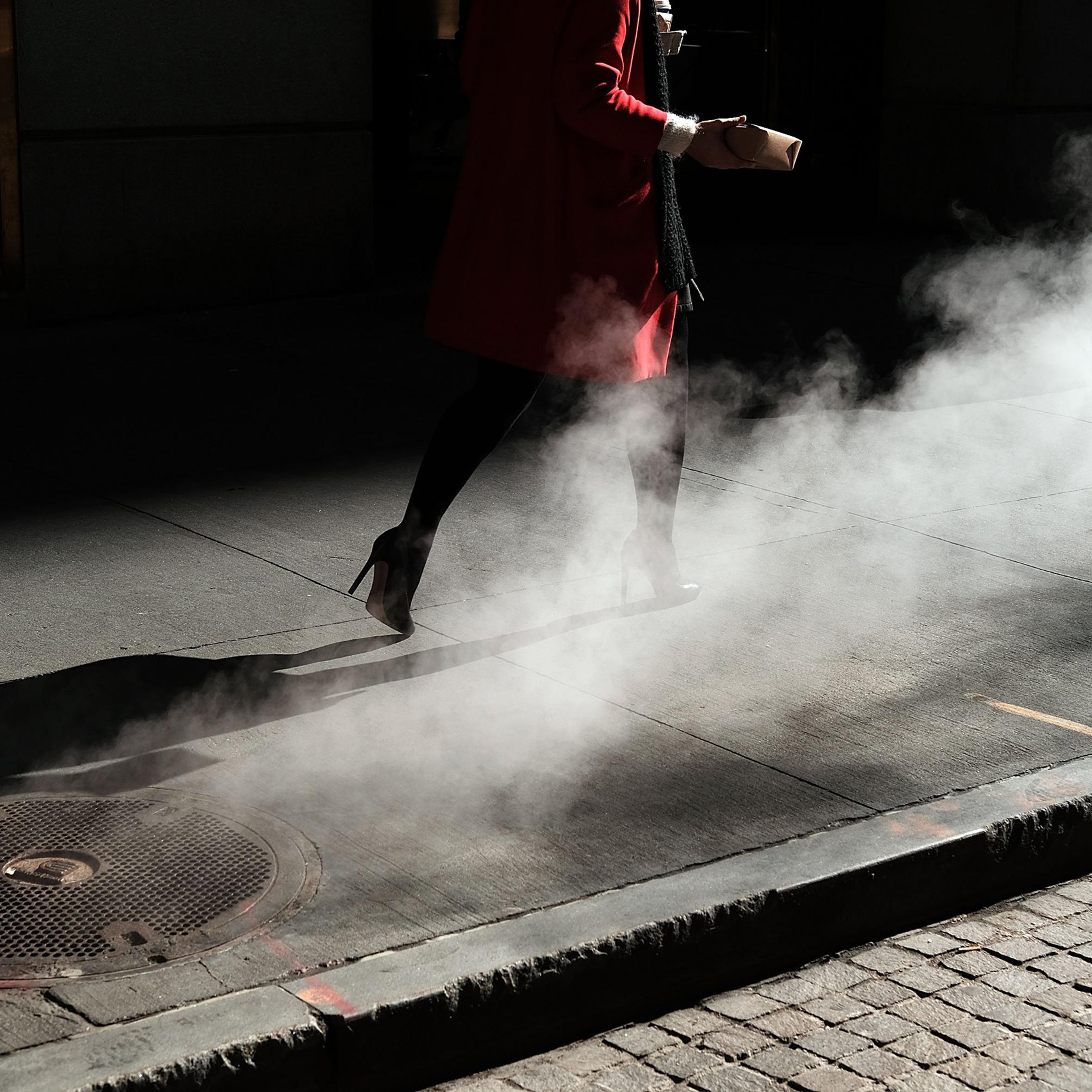 NEW YORK, NY - MARCH 21: A woman walks by the New York Stock Exchange (NYSE) near Wall Street on March 21, 2016 in New York City. Following a strong week for US stocks, the Dow Jones industrial average was down slightly in morning trading. (Photo by Spen