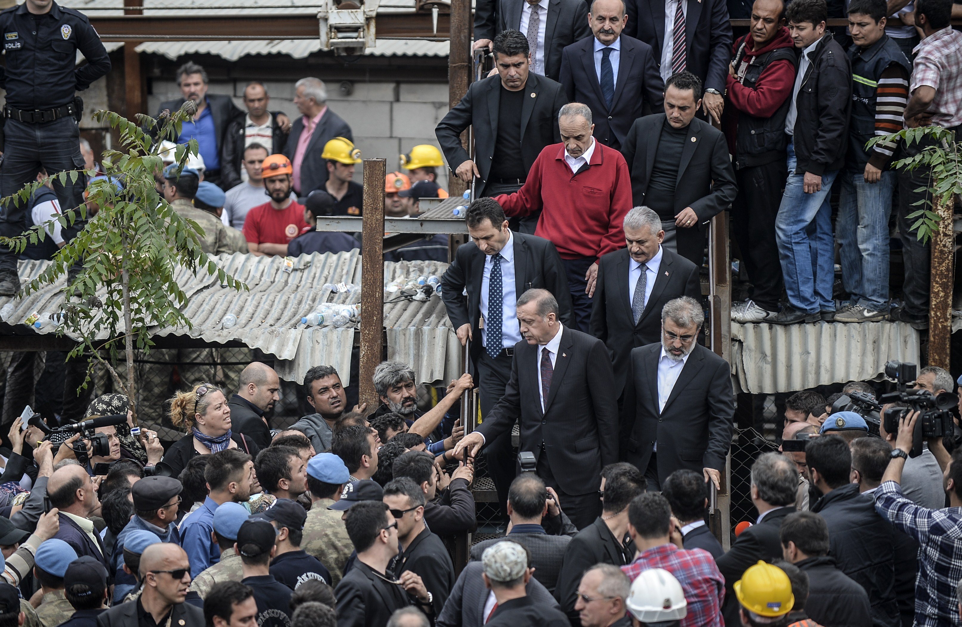 Turkish prime minister Recep Tayyip Erdogan visits the site where 120 workers were believed to remain trapped in a mine after a deadly explosion that claimed the lives of of well over 200 people on May 14, 2014 in a coal mine of the western Turkish provi