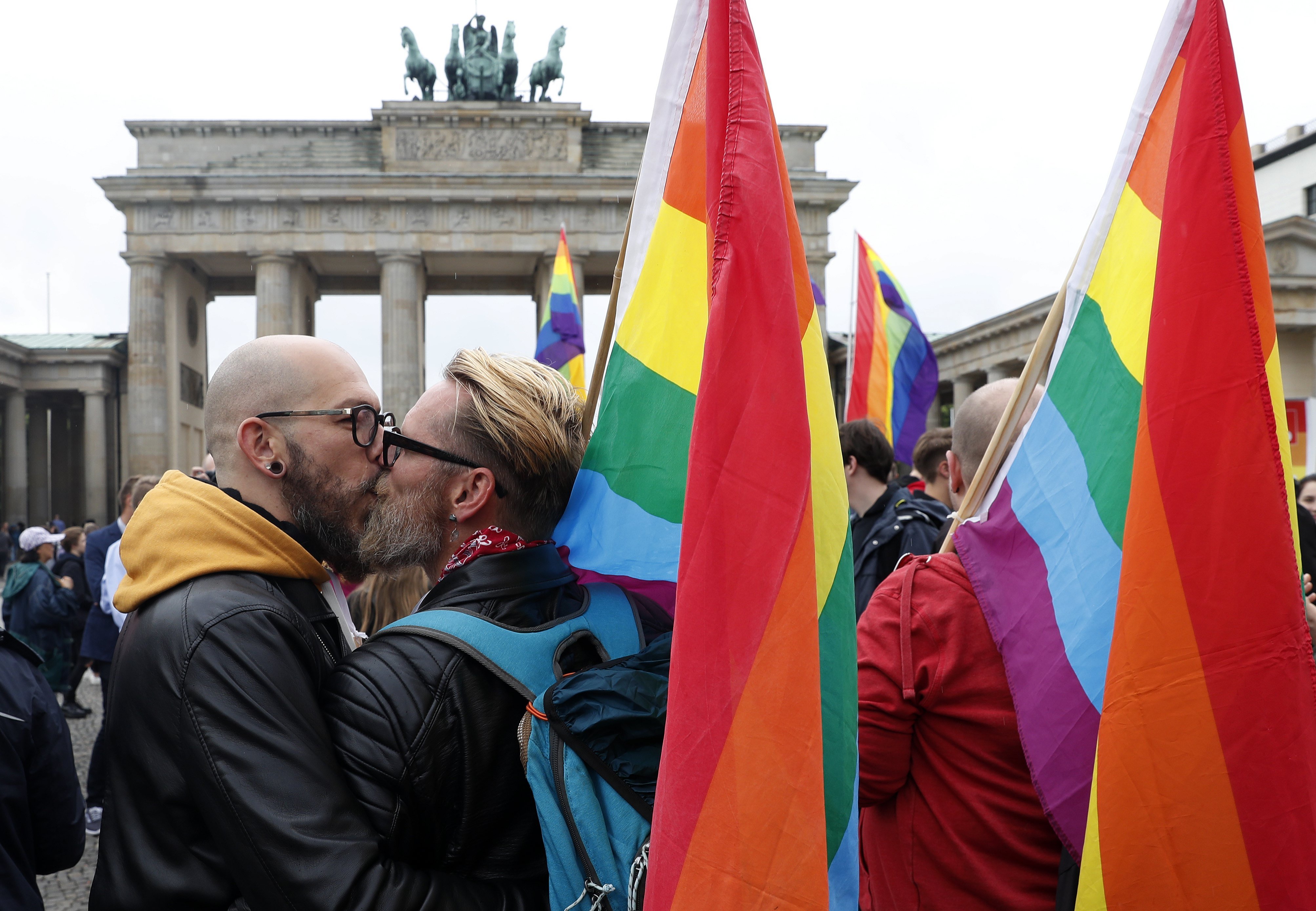 A pair kisses in front of the Brandenburg Gate as they celebrate the legalization of the same sex marriage approved by the German Parliament (Bundestag) earlier, in Berlin, June 30, 2017.