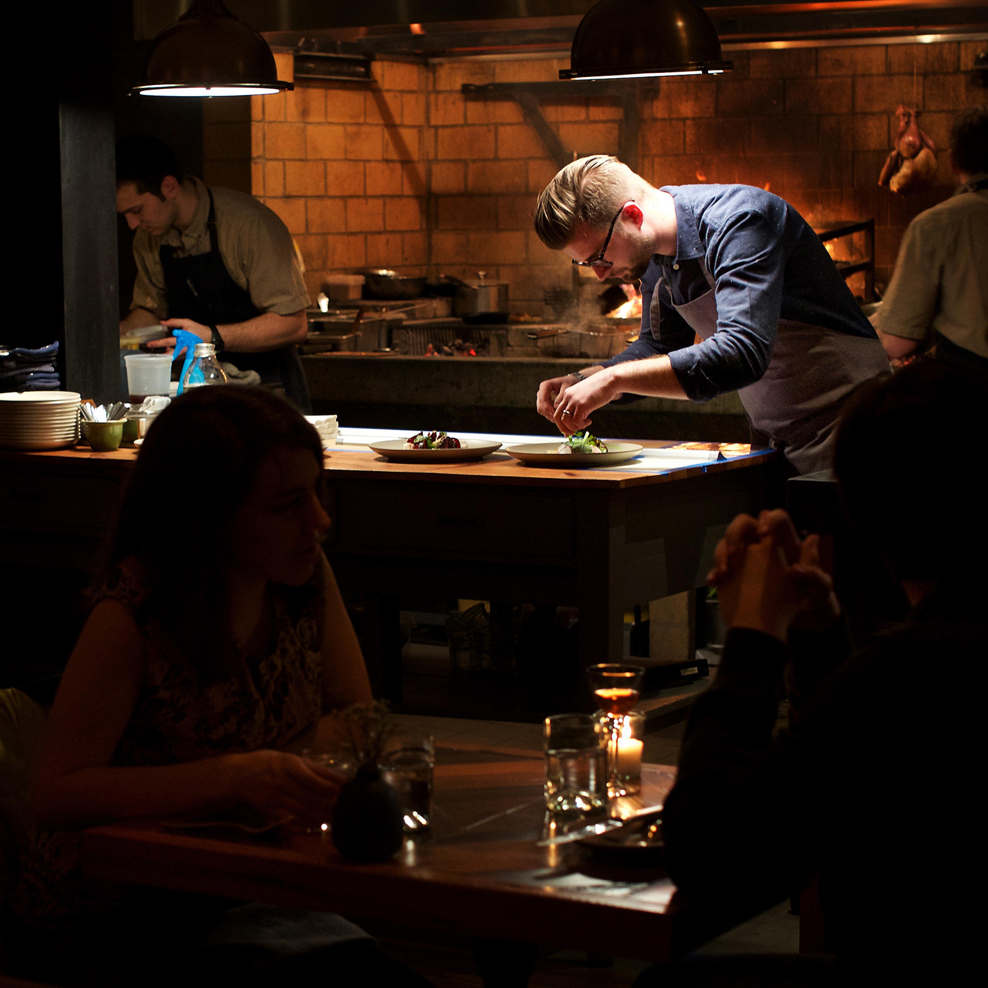 Chef Jeremiah Langhorne preps food during the dinner service at his restaurant, The Dabney, in the Shaw neighborhood in Washington, D.C.