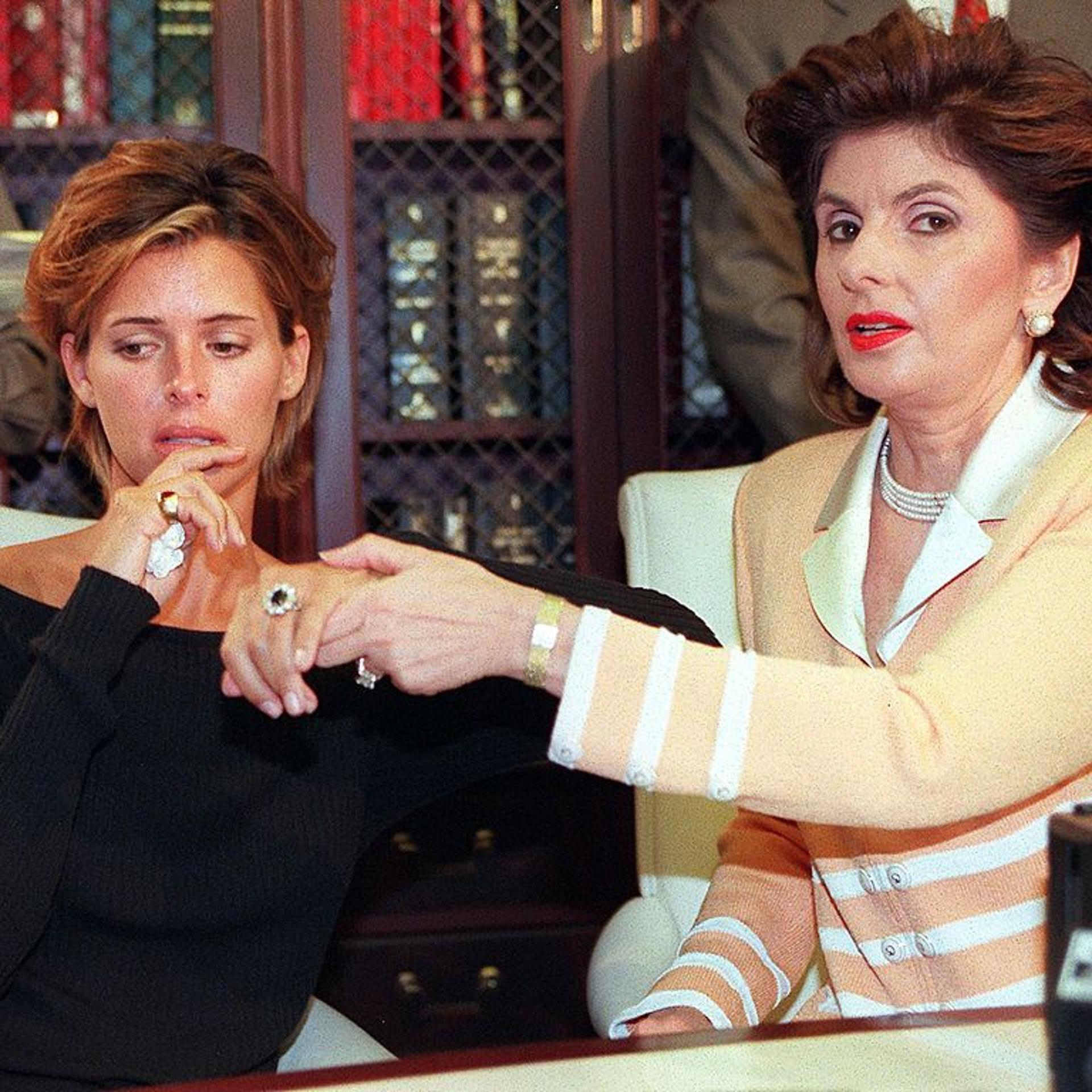 US model Kelly Fisher, 31, (L) and her attorney Gl